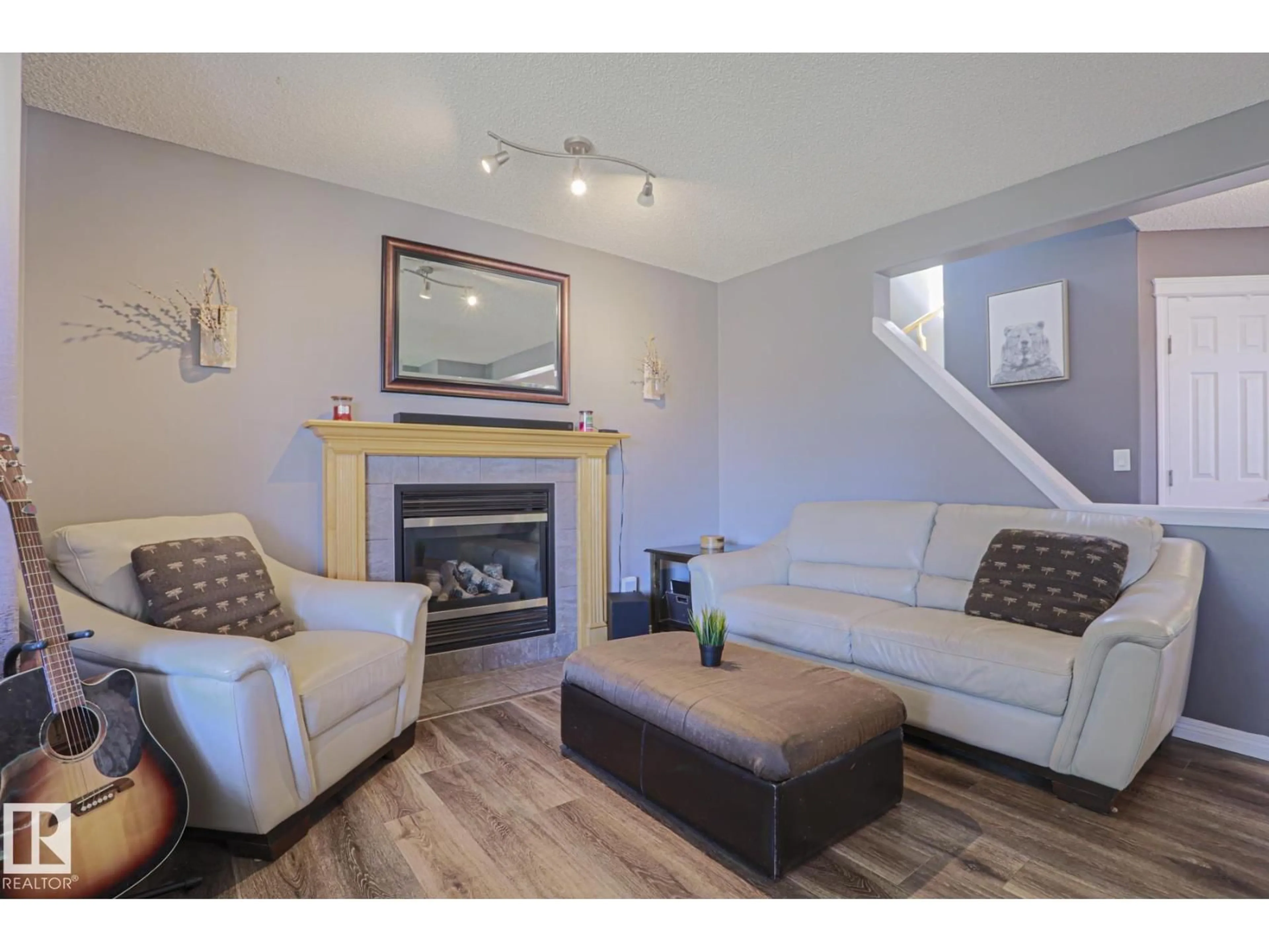Living room with furniture, wood/laminate floor for 17468 89 ST, Edmonton Alberta T5Z3X9