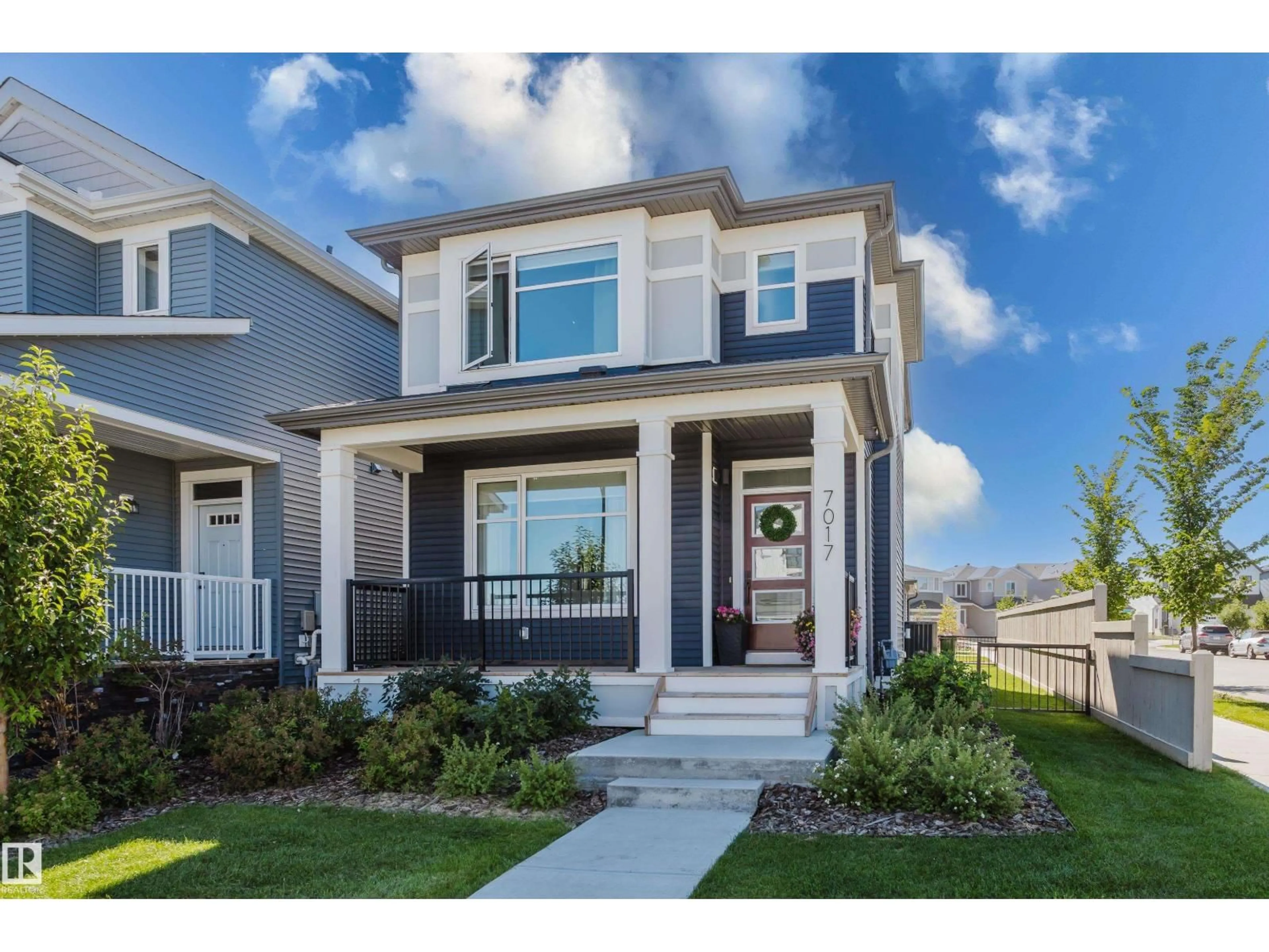 Home with vinyl exterior material, street for 7017 52 AV, Beaumont Alberta T4X2Z8