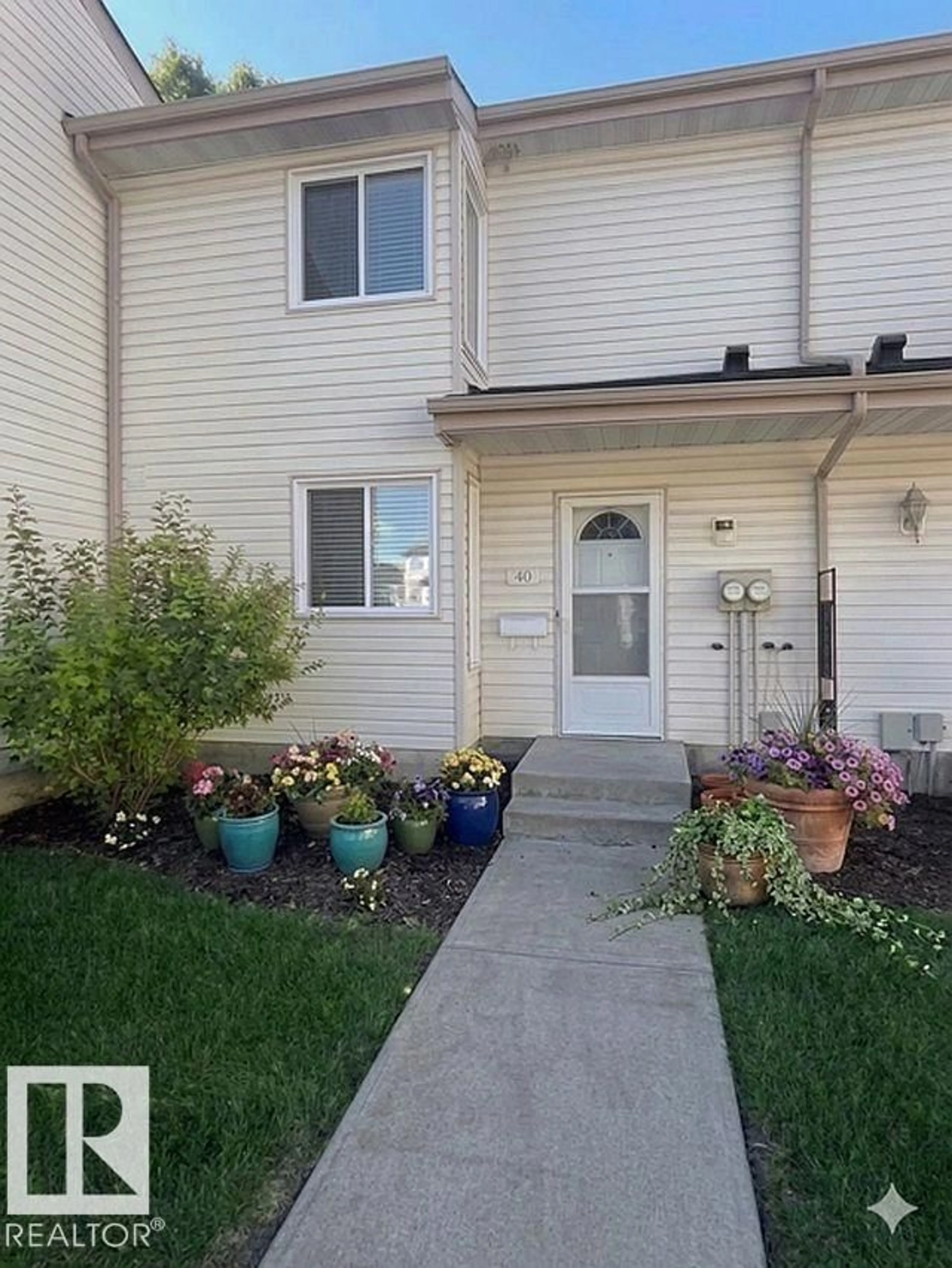 Home with vinyl exterior material, street for #40 - 2024 57 ST, Edmonton Alberta T6L2Z3