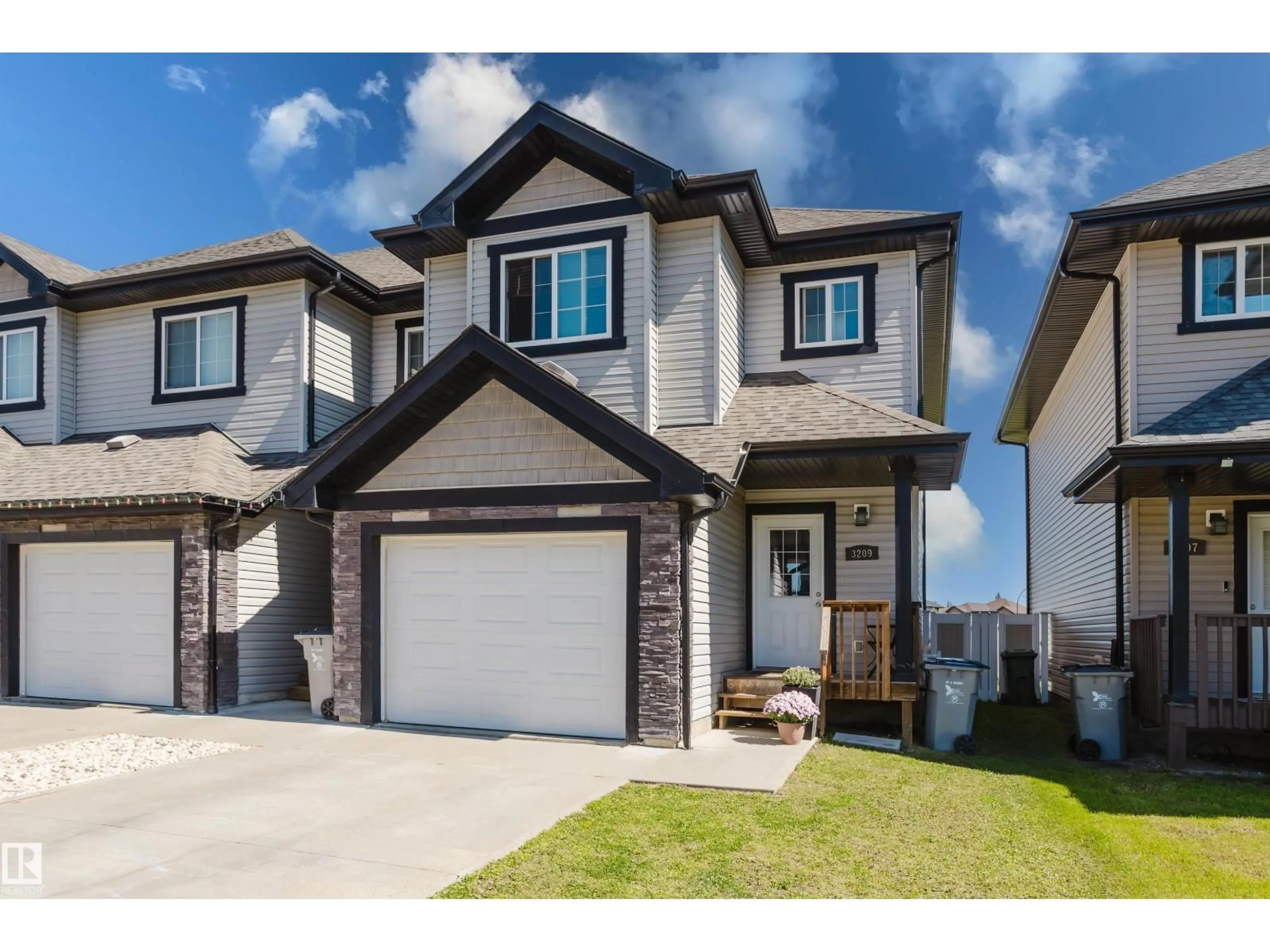 Home with vinyl exterior material, street for 3209 67 ST, Beaumont Alberta T4X0W7