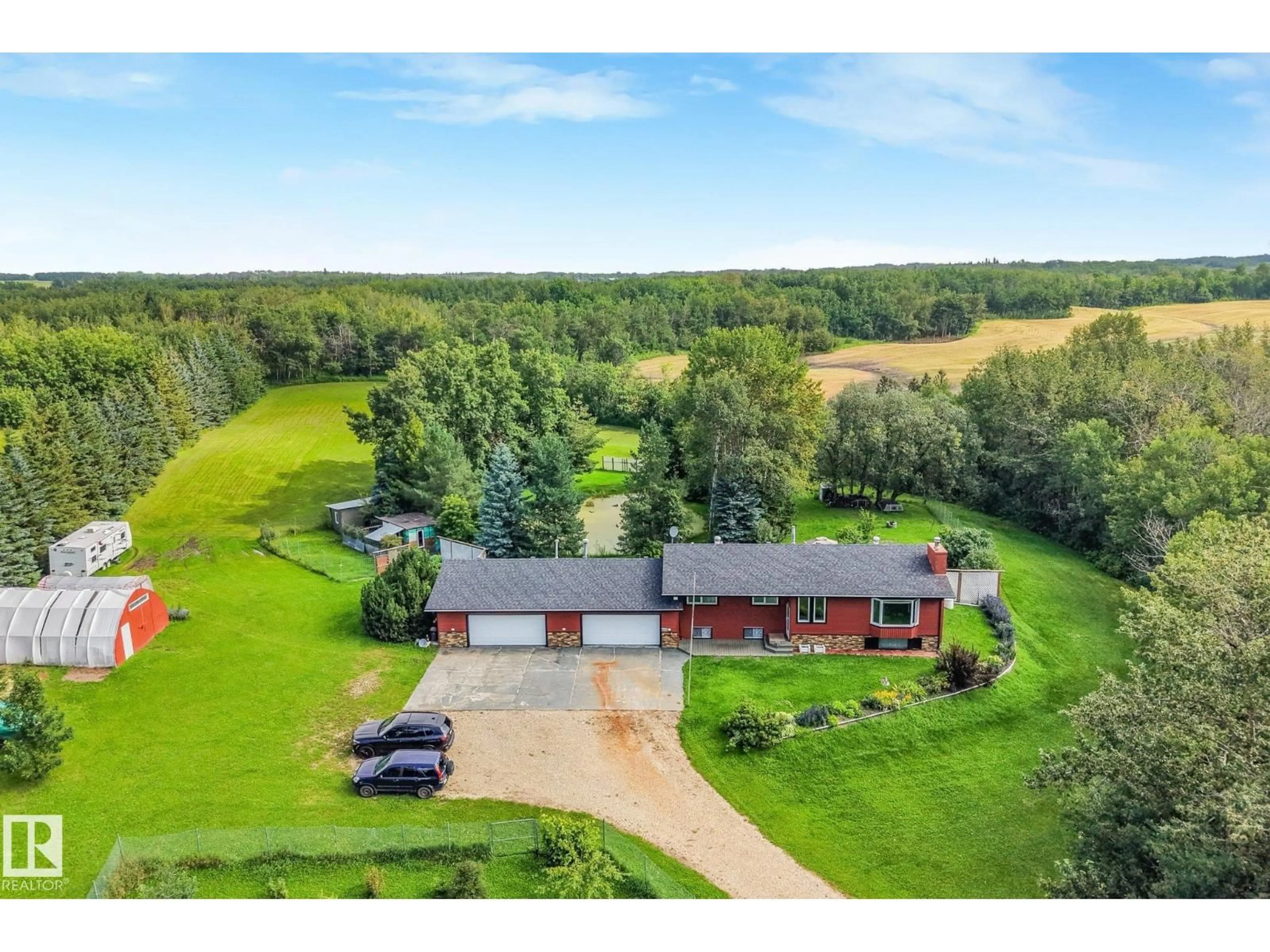 A pic from outside/outdoor area/front of a property/back of a property/a pic from drone, unknown for 193 53111 RGE ROAD 220, Rural Strathcona County Alberta T8E2C6