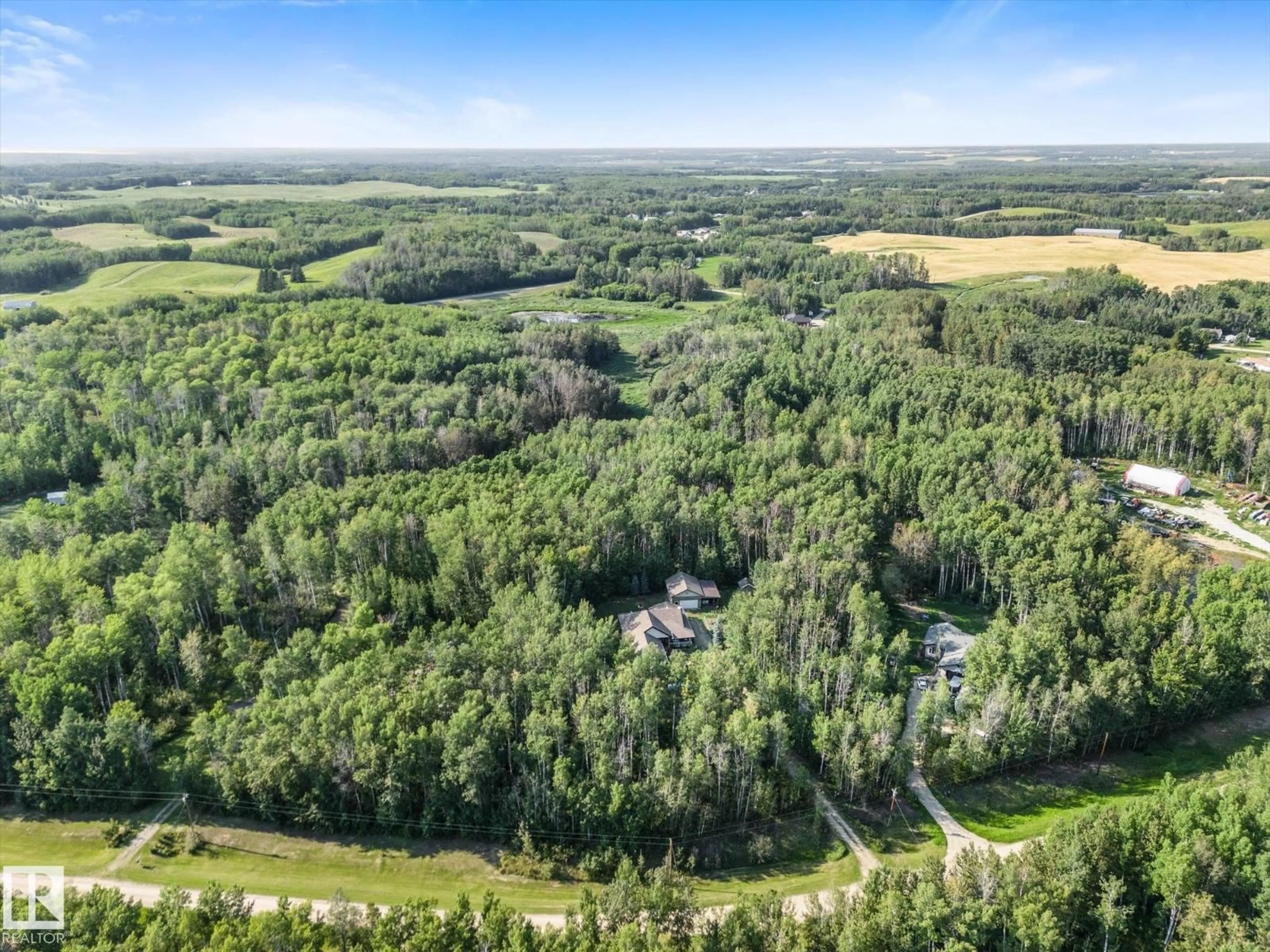A pic from outside/outdoor area/front of a property/back of a property/a pic from drone, forest/trees view for 36 52229 RGE ROAD 25, Rural Parkland County Alberta T7Y2M3