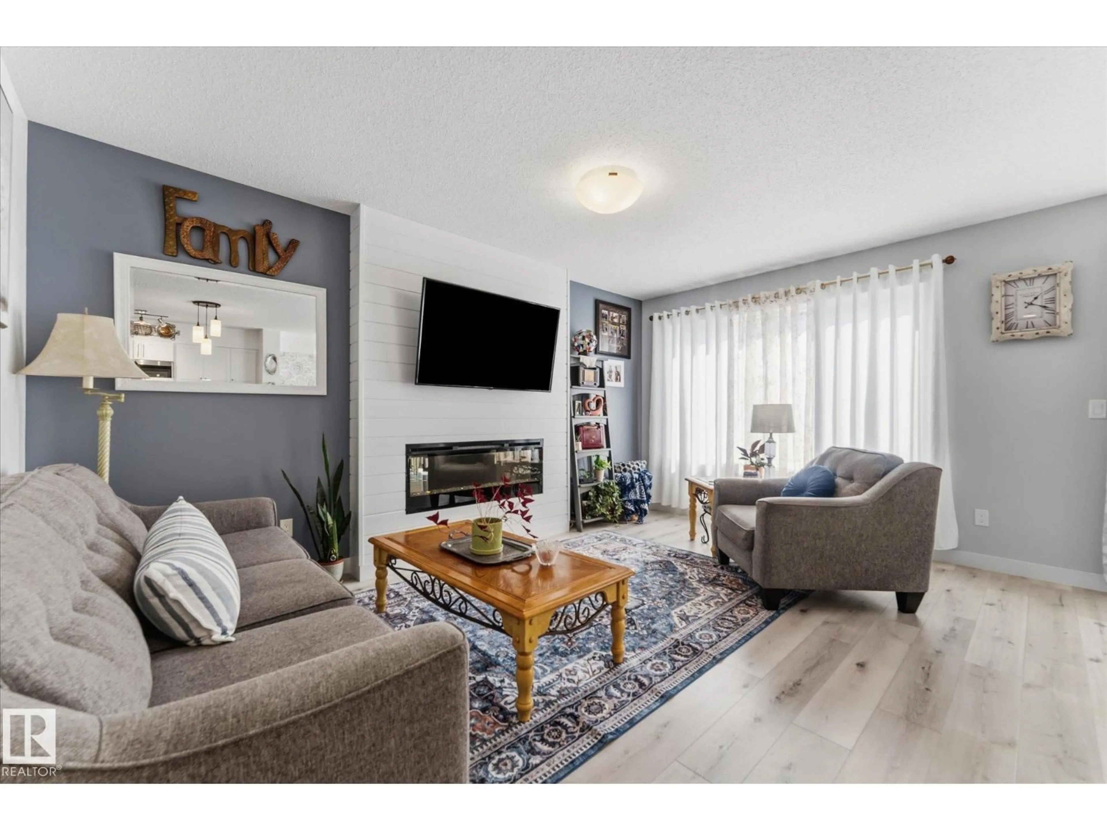 Living room with furniture, wood/laminate floor for 11 CALEDON CR, Spruce Grove Alberta T7X0X8