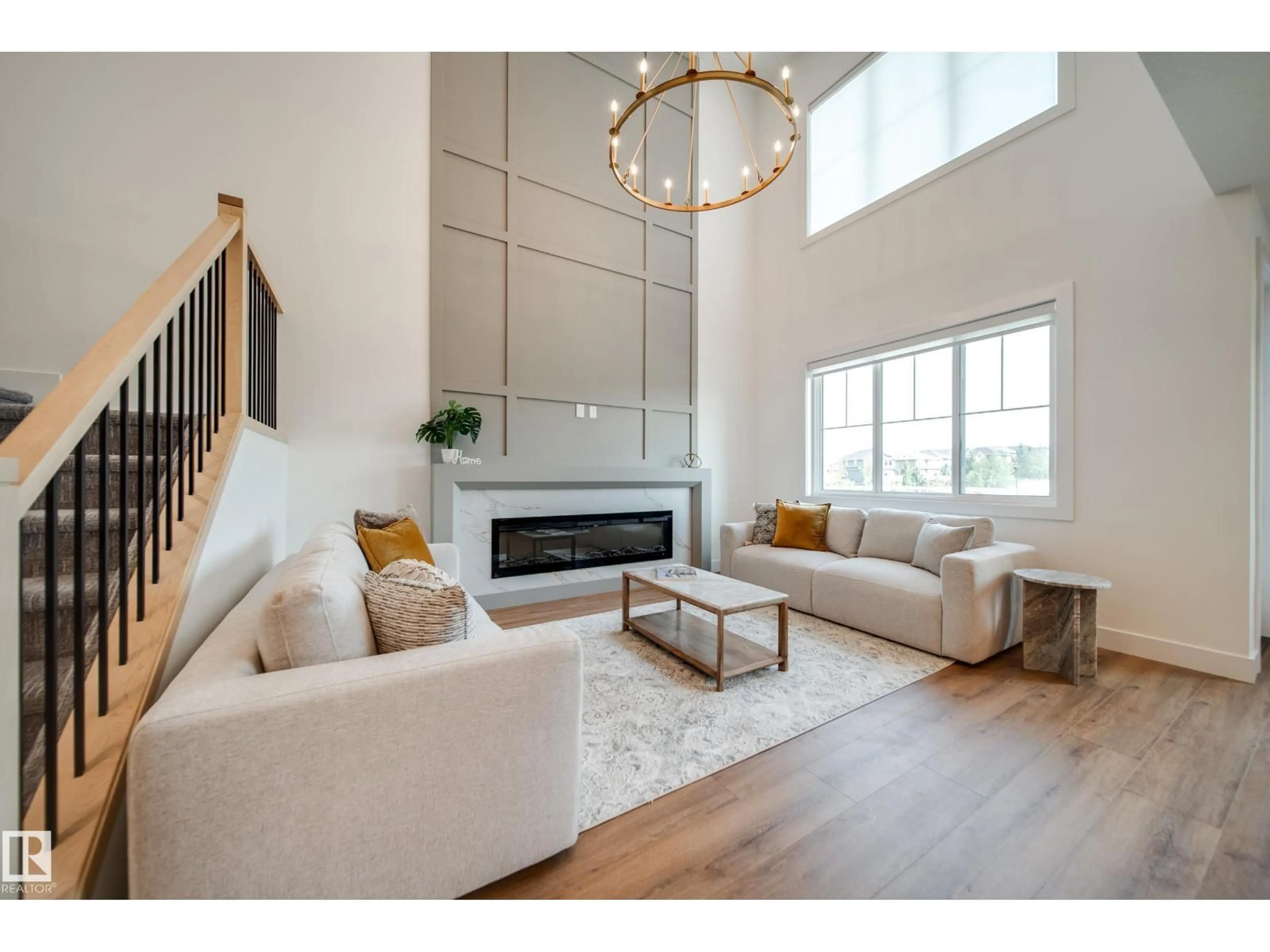 Living room with furniture, wood/laminate floor for 3337 CHICKADEE DR, Edmonton Alberta T5S0V6