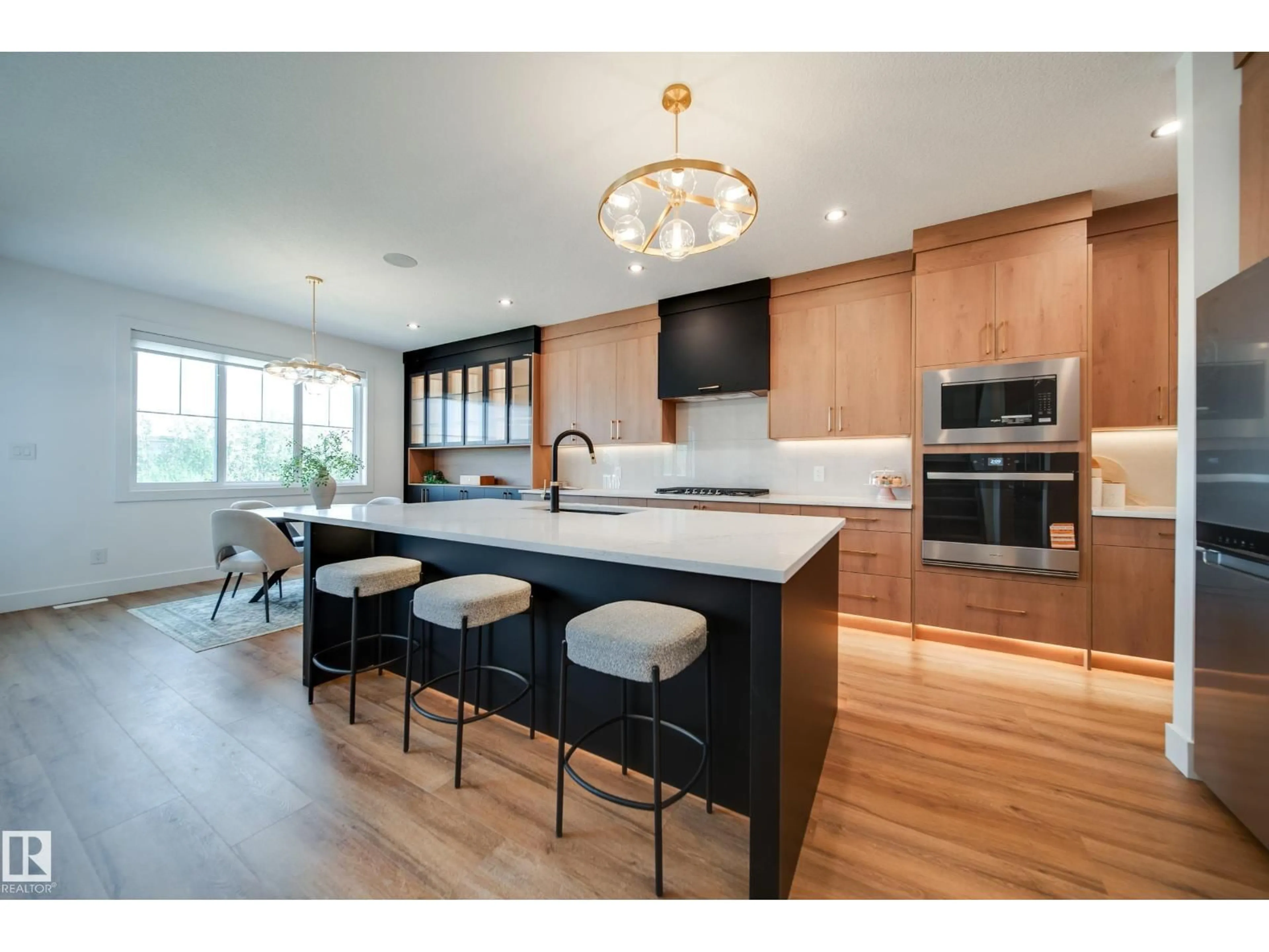 Open concept kitchen, wood/laminate floor for 3337 CHICKADEE DR, Edmonton Alberta T5S0V6