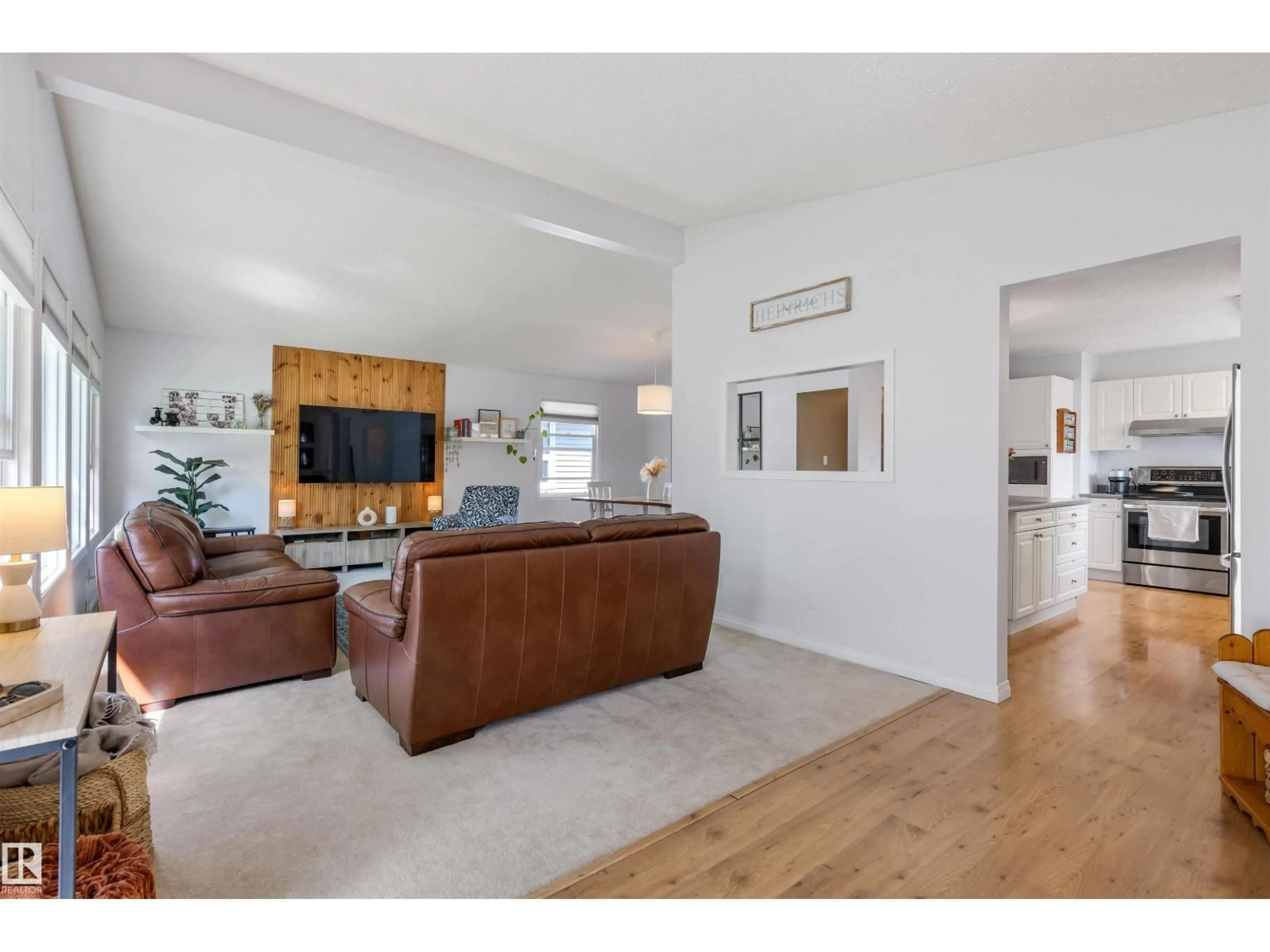 Living room with furniture, wood/laminate floor for 25 AMHERST CR, St. Albert Alberta T8N2P7