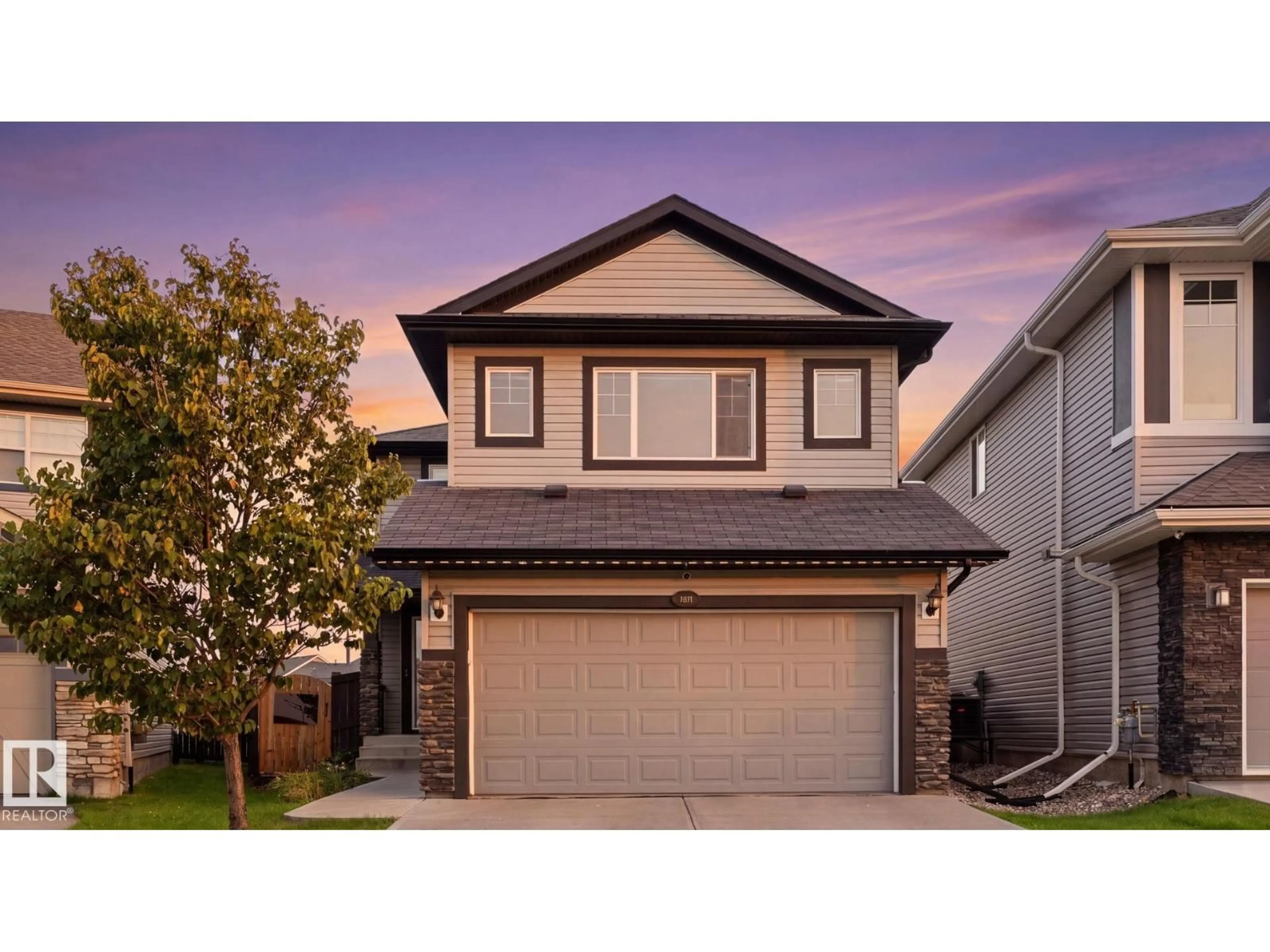 Home with vinyl exterior material, street for 3613 167A AV, Edmonton Alberta T5Y0X6