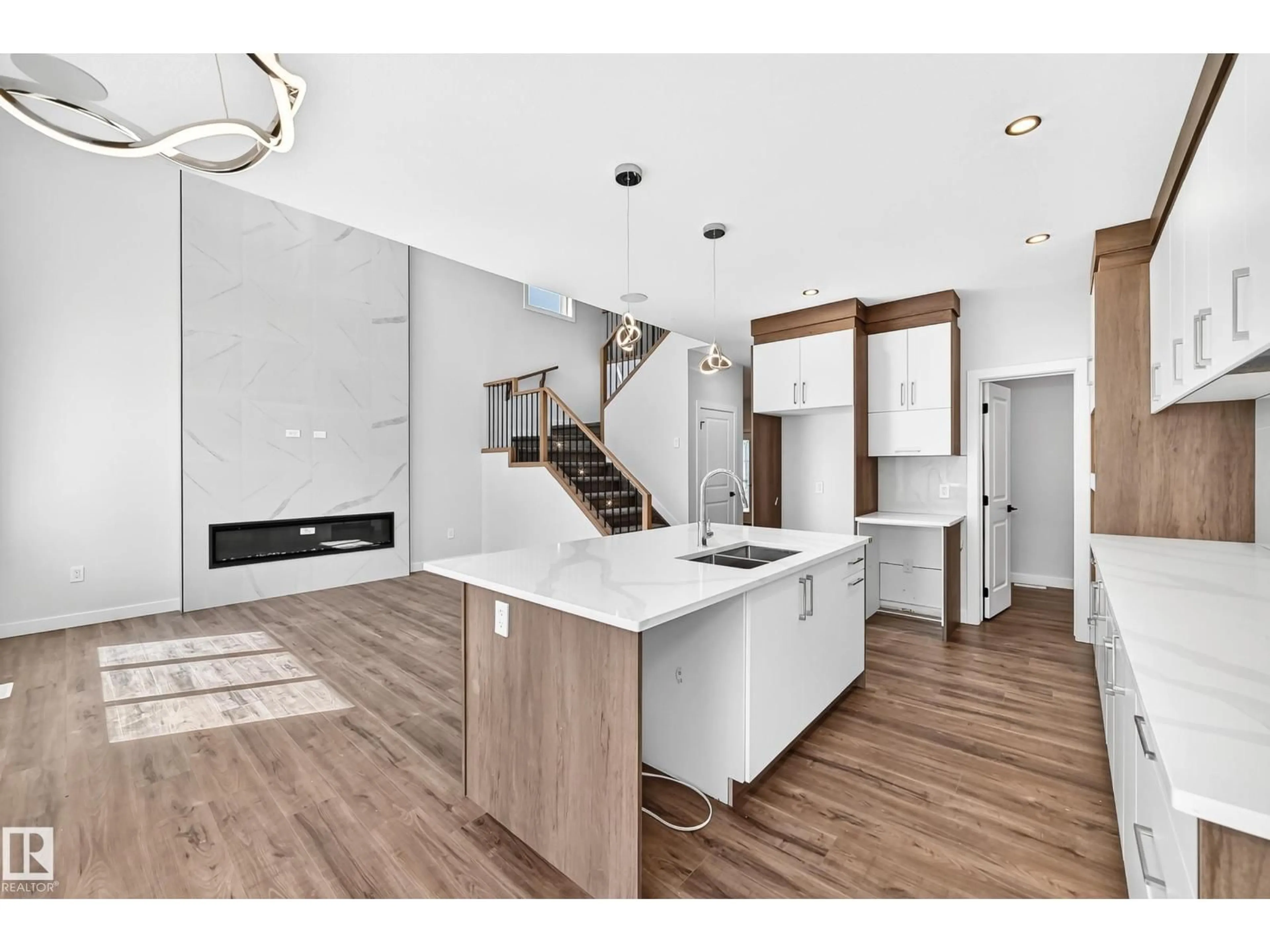 Open concept kitchen, wood/laminate floor for 19 TEAKWOOD TC, Spruce Grove Alberta T7X4S9