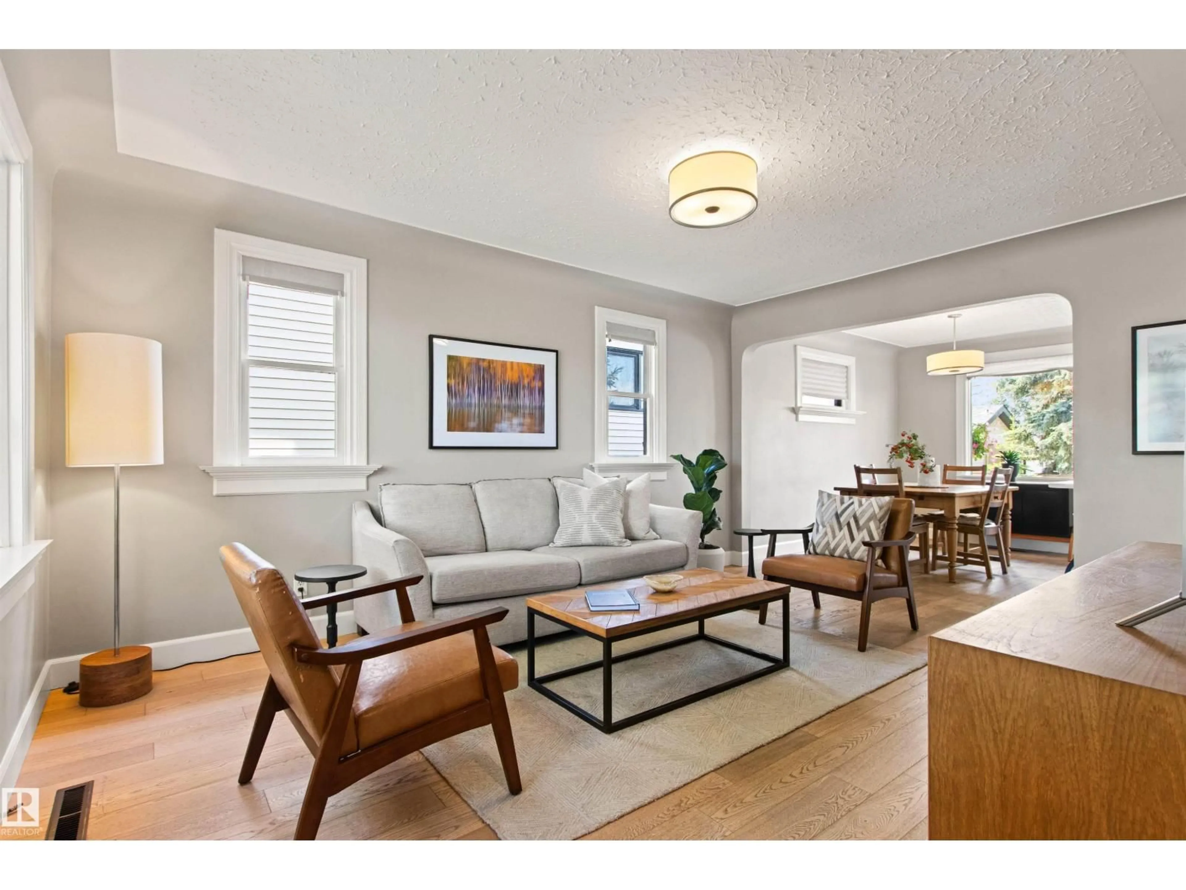 Living room with furniture, wood/laminate floor for 10741 70 AV, Edmonton Alberta T6H2G4