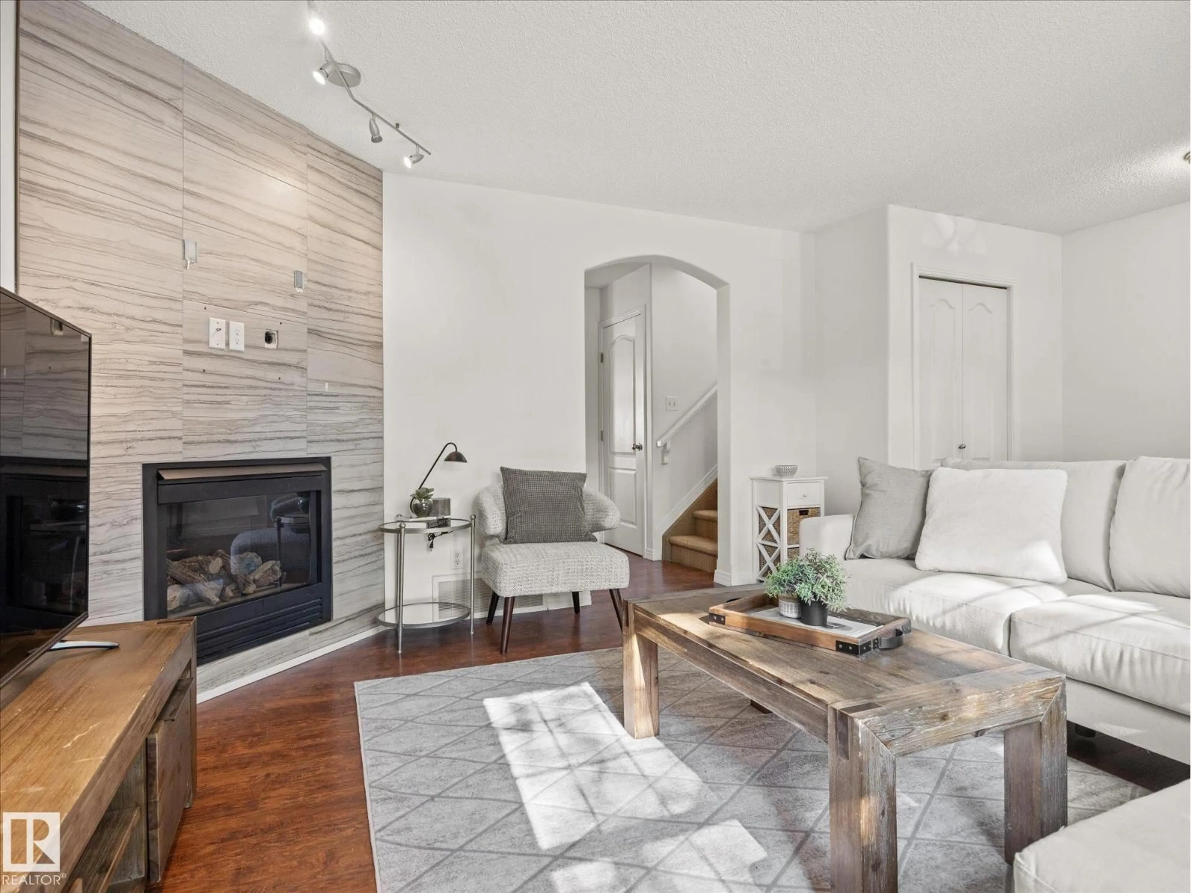 Living room with furniture, wood/laminate floor for NW - 1502 GRANT WY, Edmonton Alberta T5T6M9