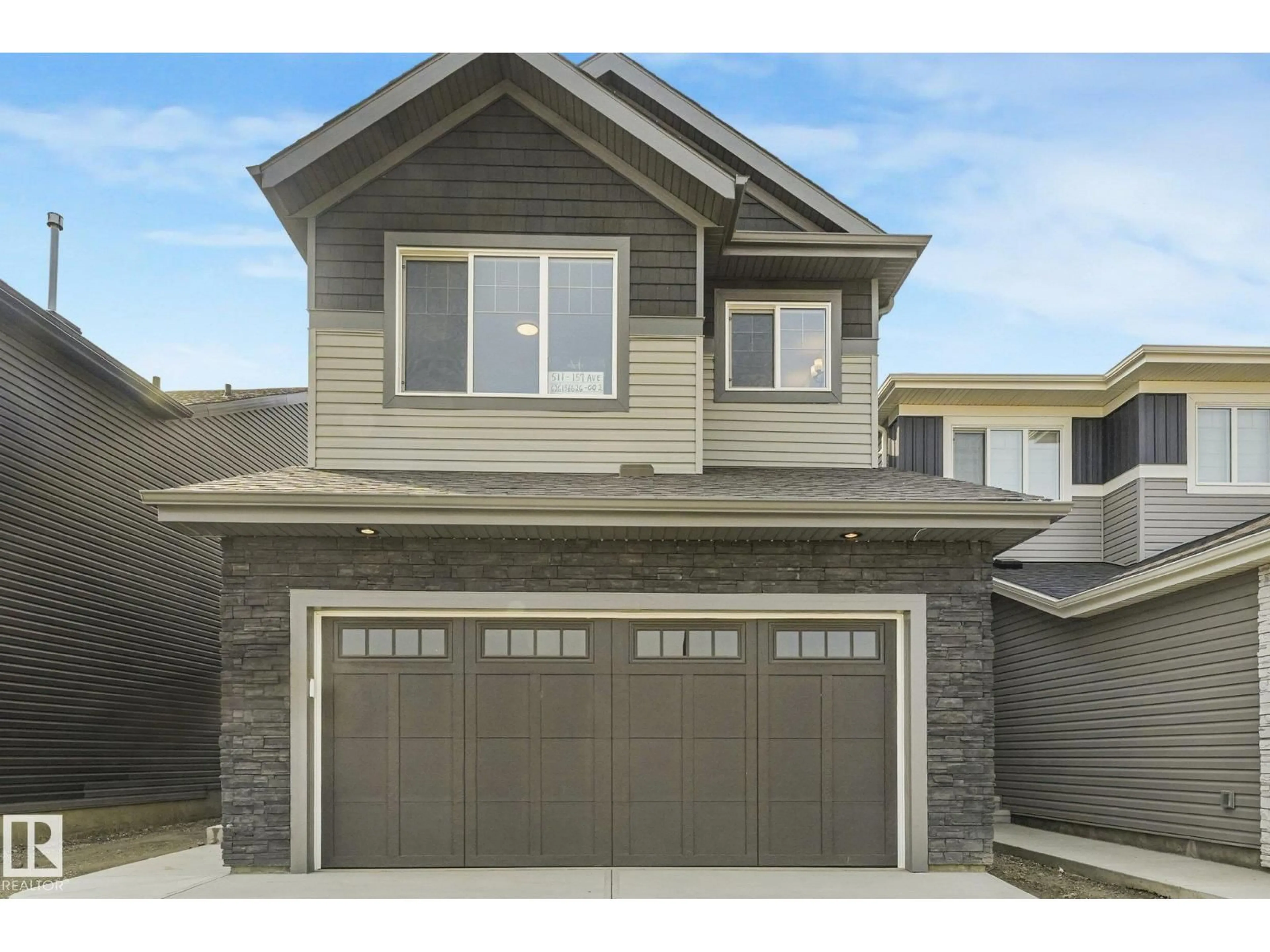 Home with vinyl exterior material, street for NE - 511 157 AV, Edmonton Alberta T5Y4N2