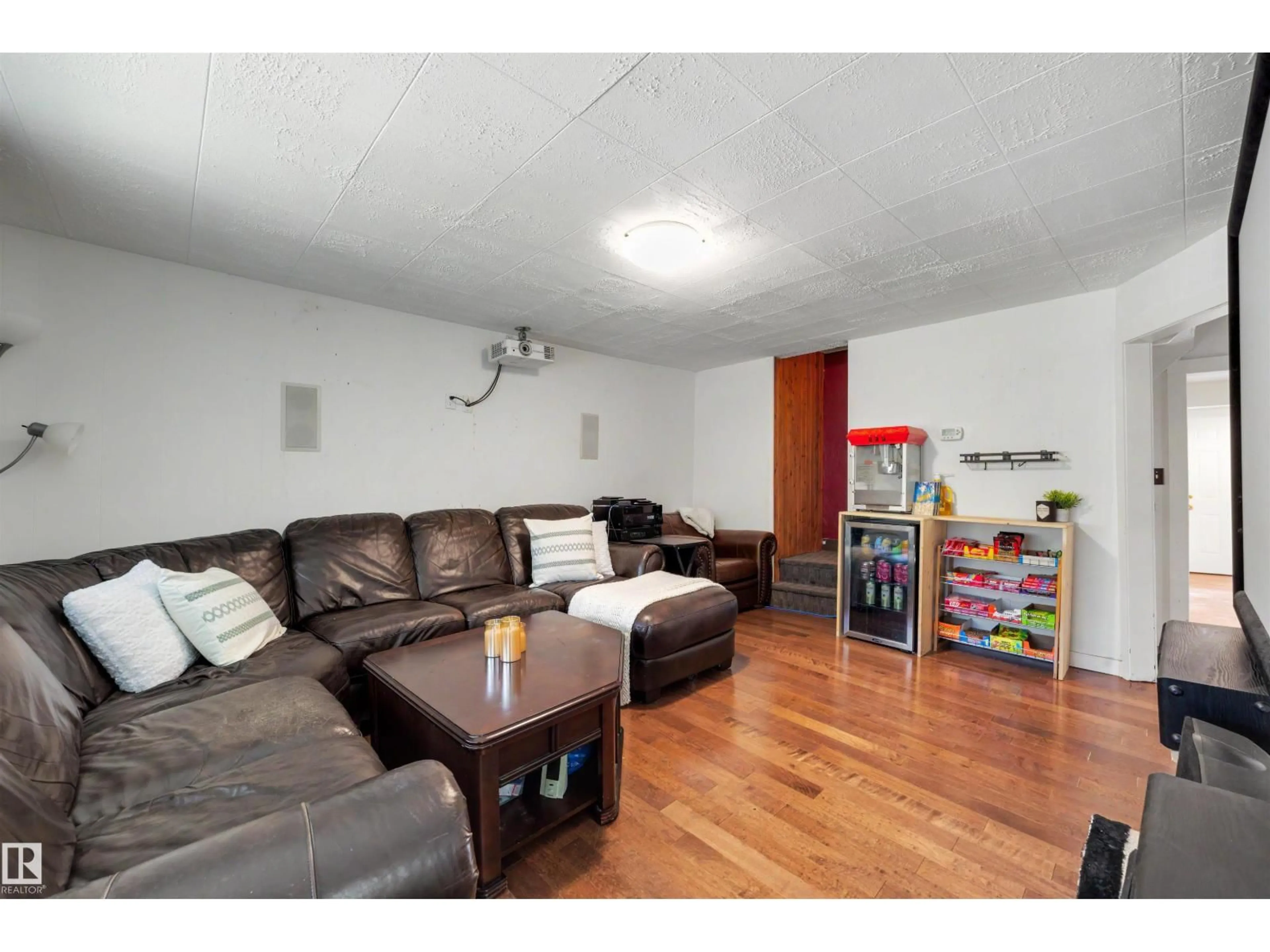 Living room with furniture, wood/laminate floor for 12771 119 ST, Edmonton Alberta T5E5M2