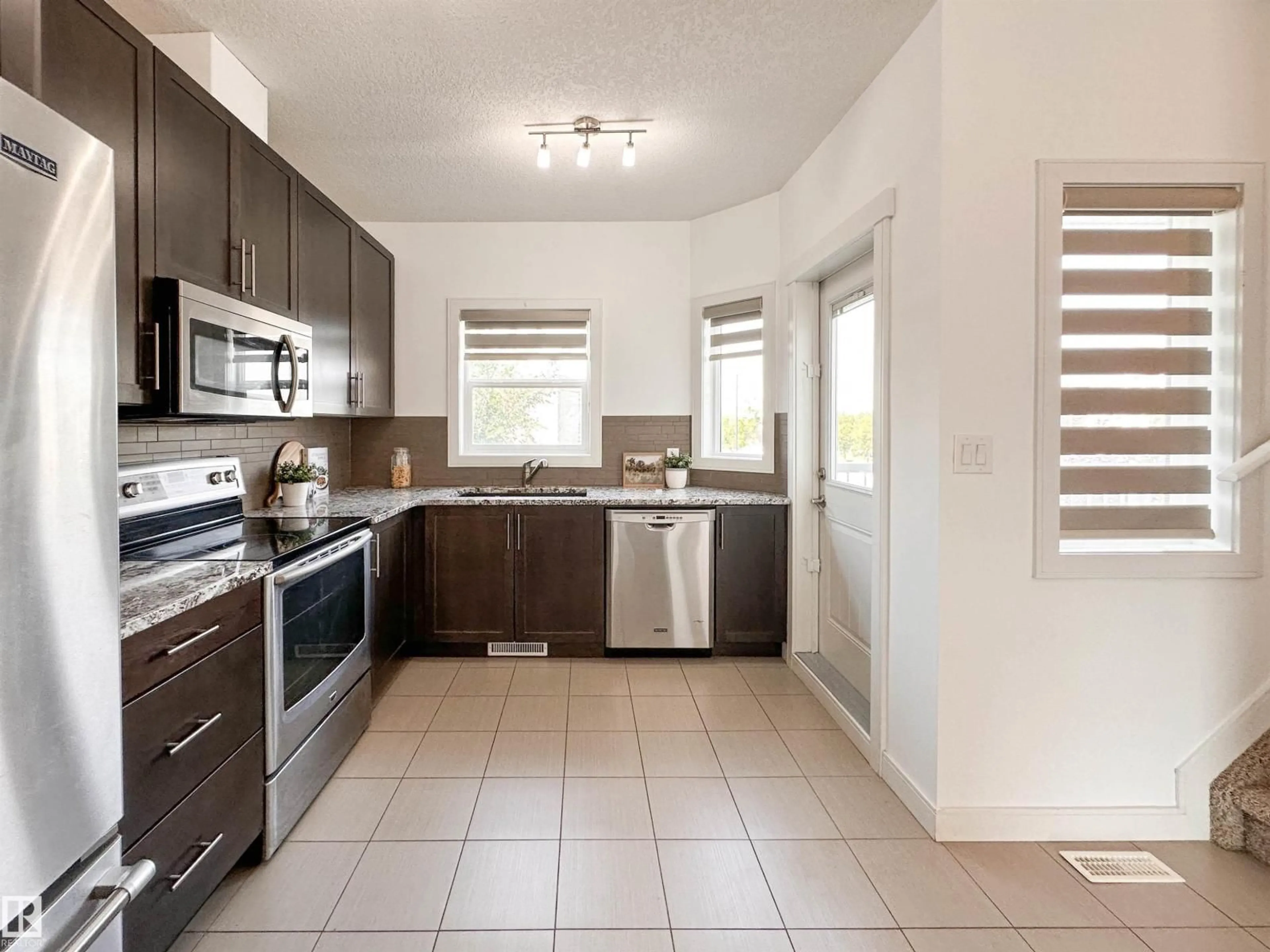 Open concept kitchen, ceramic/tile floor for #11 - 150 EVERITT DR, St. Albert Alberta T8N7R8