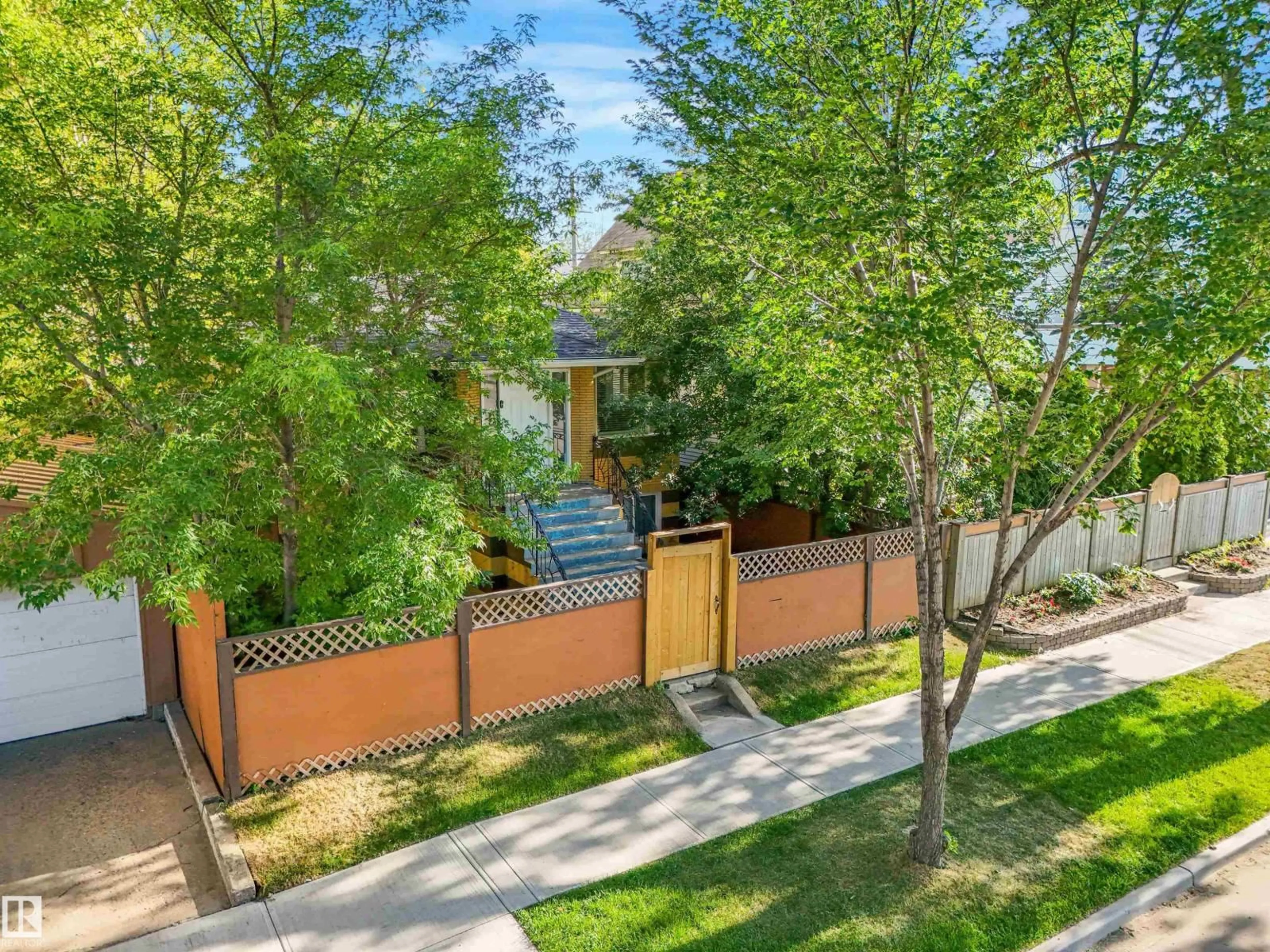 A pic from outside/outdoor area/front of a property/back of a property/a pic from drone, street for 9347 105 AV NW, Edmonton Alberta T5H0J7