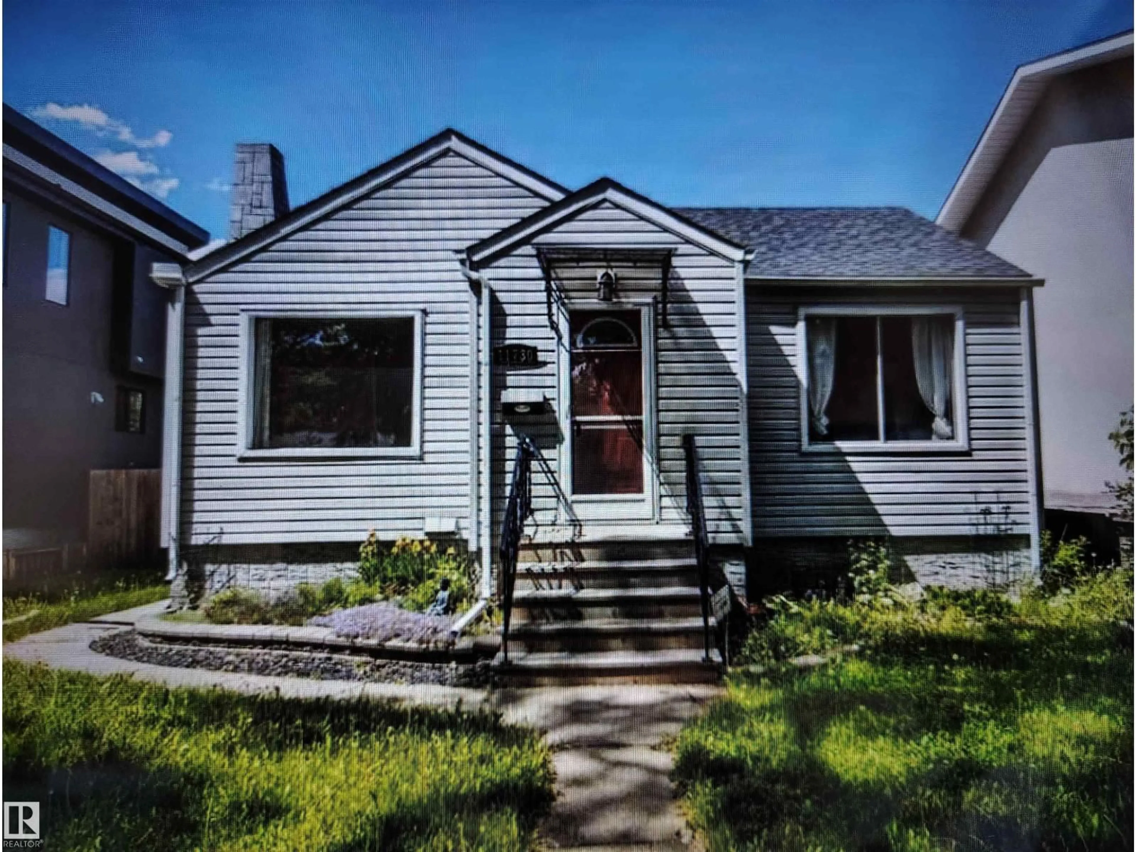 Home with vinyl exterior material, street for NW - 11730 125 ST, Edmonton Alberta T5M0N6