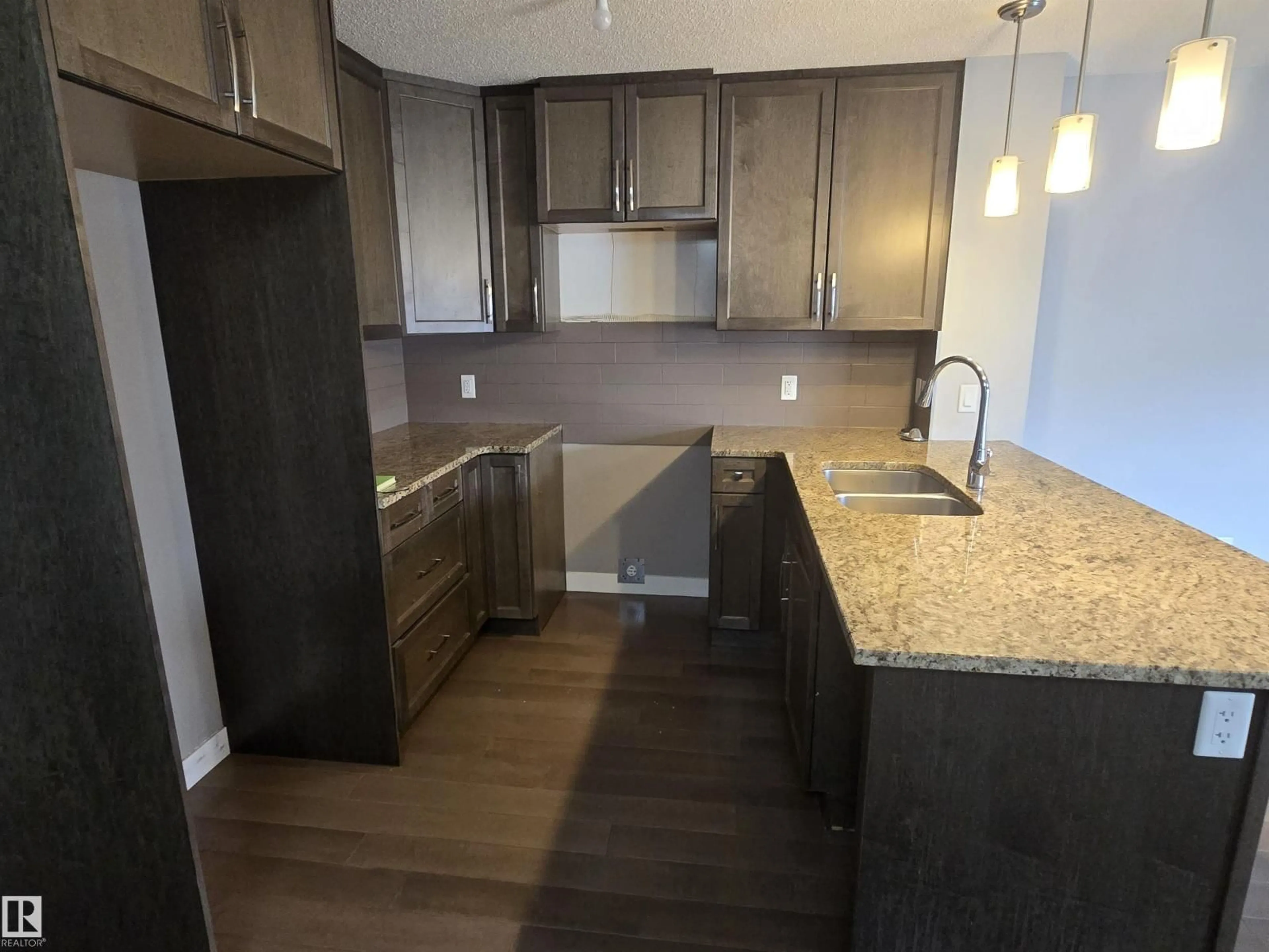Open concept kitchen, wood/laminate floor for NW - 2207 44 AV, Edmonton Alberta T6T0W6