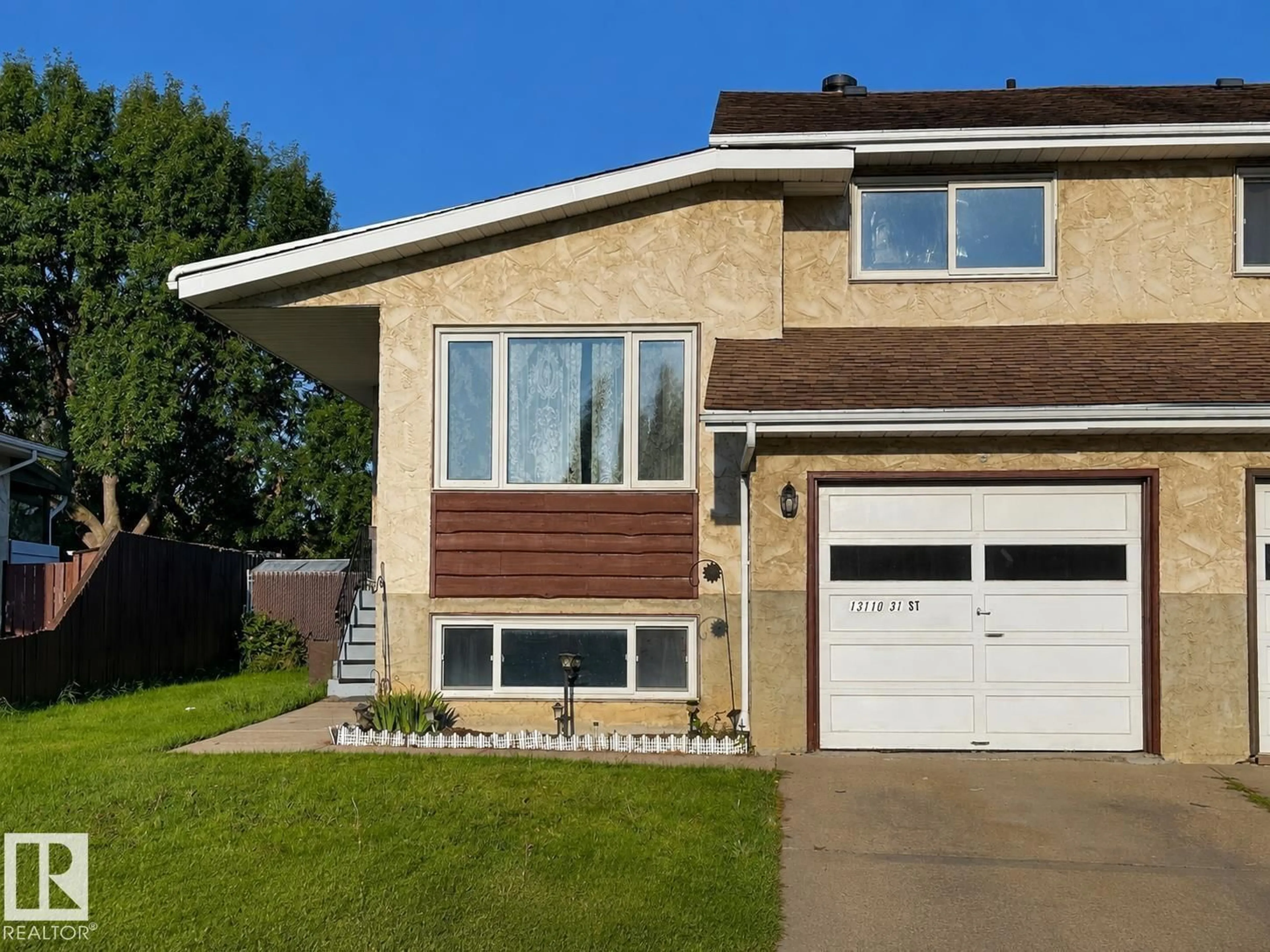 Home with vinyl exterior material, street for 13110 31 ST, Edmonton Alberta T5A3A4