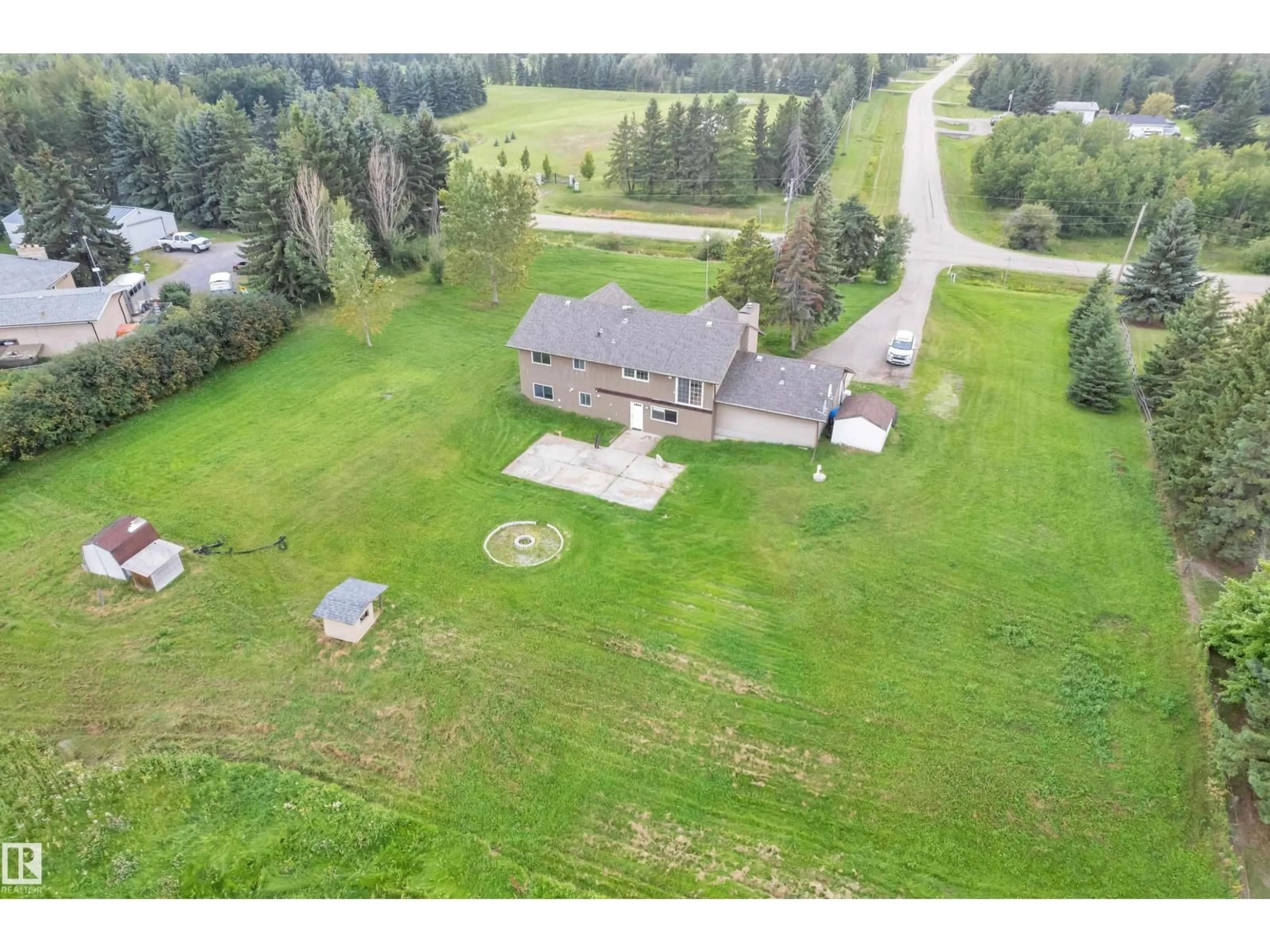 A pic from outside/outdoor area/front of a property/back of a property/a pic from drone, unknown for 51561 - 217 RGE ROAD 224, Rural Strathcona County Alberta T8C1H5