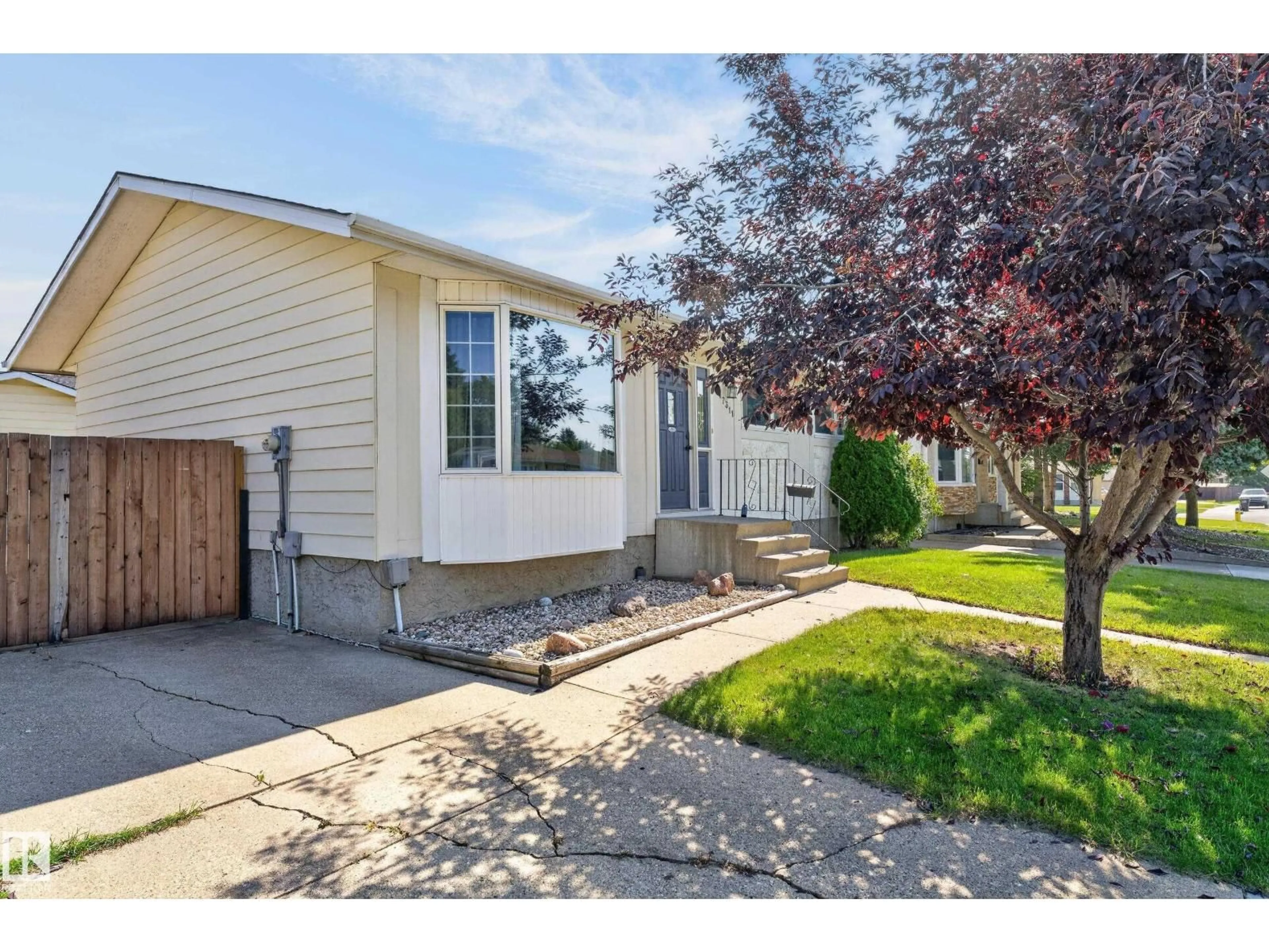 Home with vinyl exterior material, street for 17311 101 ST, Edmonton Alberta T5X4B6