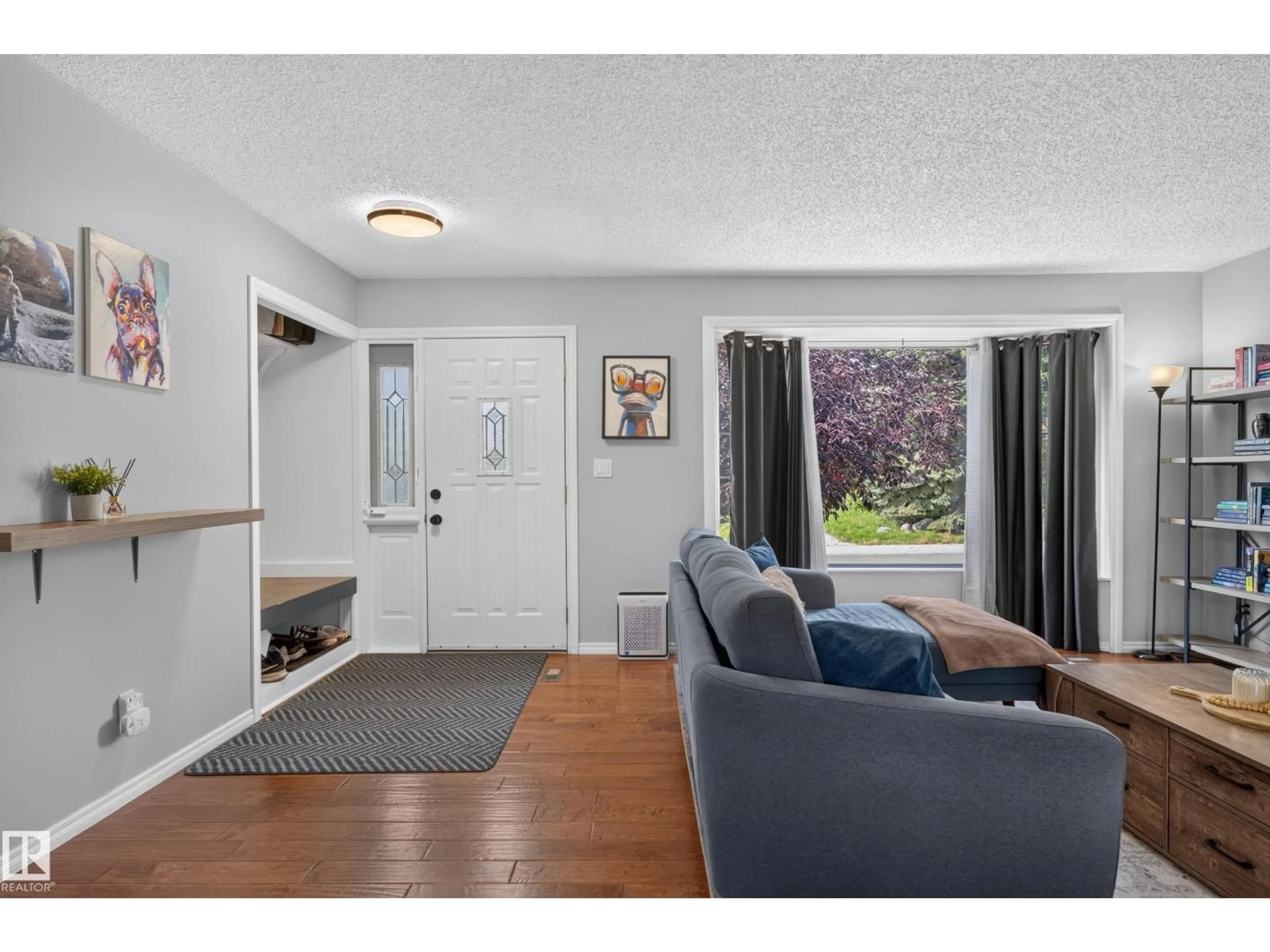 Living room with furniture, wood/laminate floor for 17311 101 ST, Edmonton Alberta T5X4B6