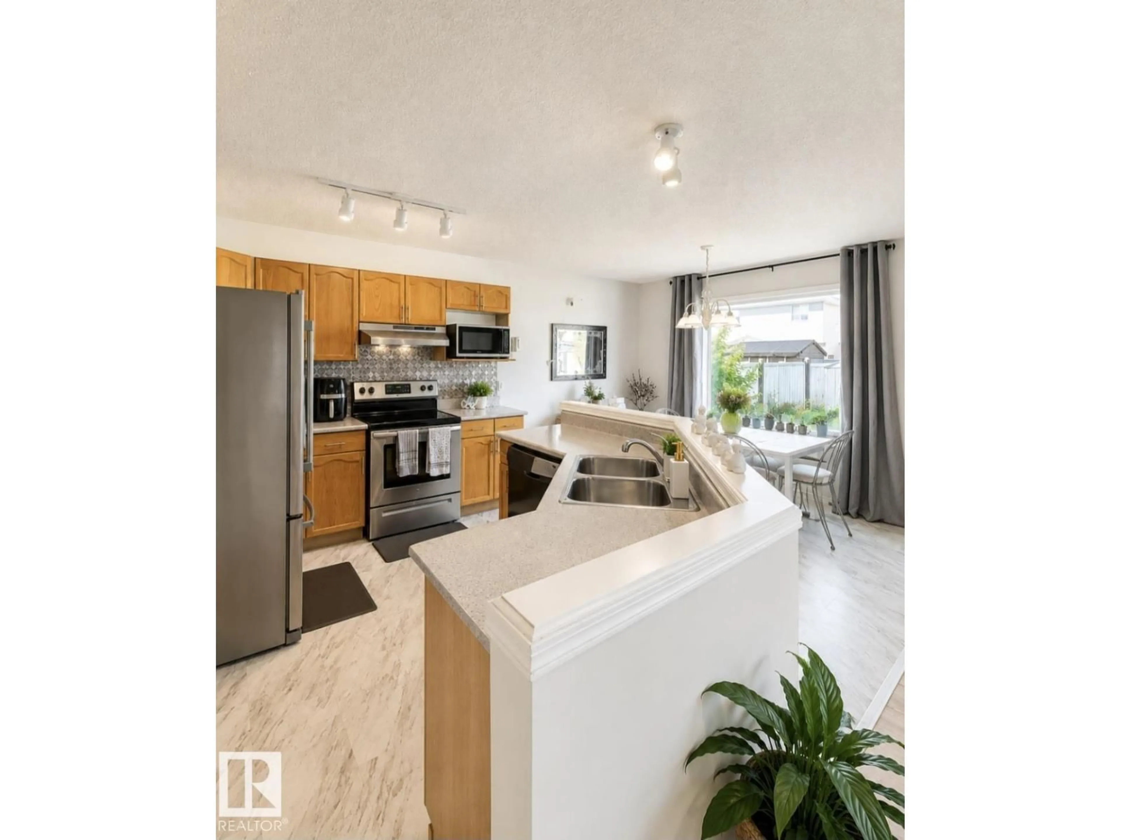 Open concept kitchen, unknown for 3236 27 AV, Edmonton Alberta T6T1P8