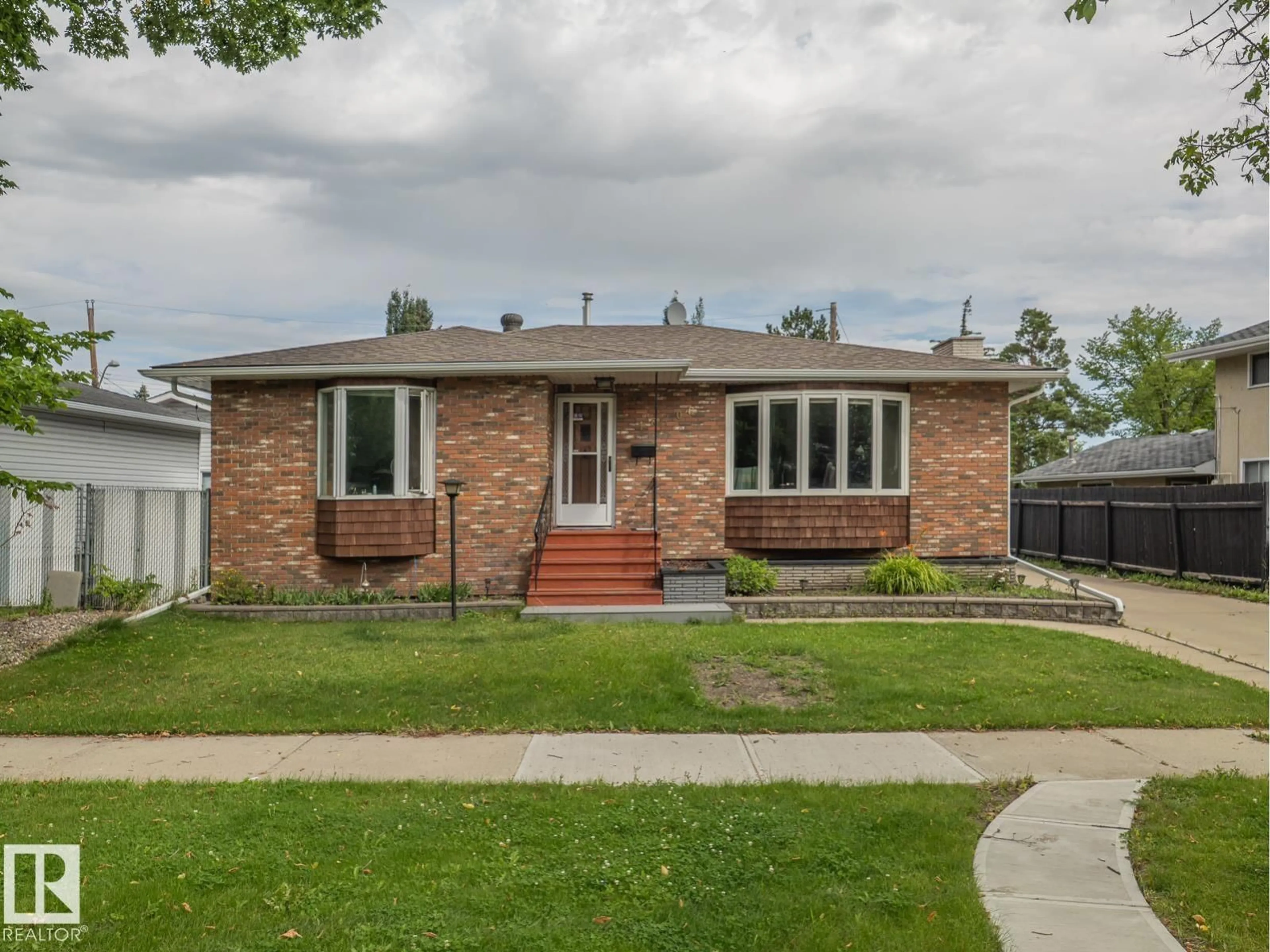 Home with brick exterior material, street for NW - 16706 80 AV, Edmonton Alberta T5R3N2