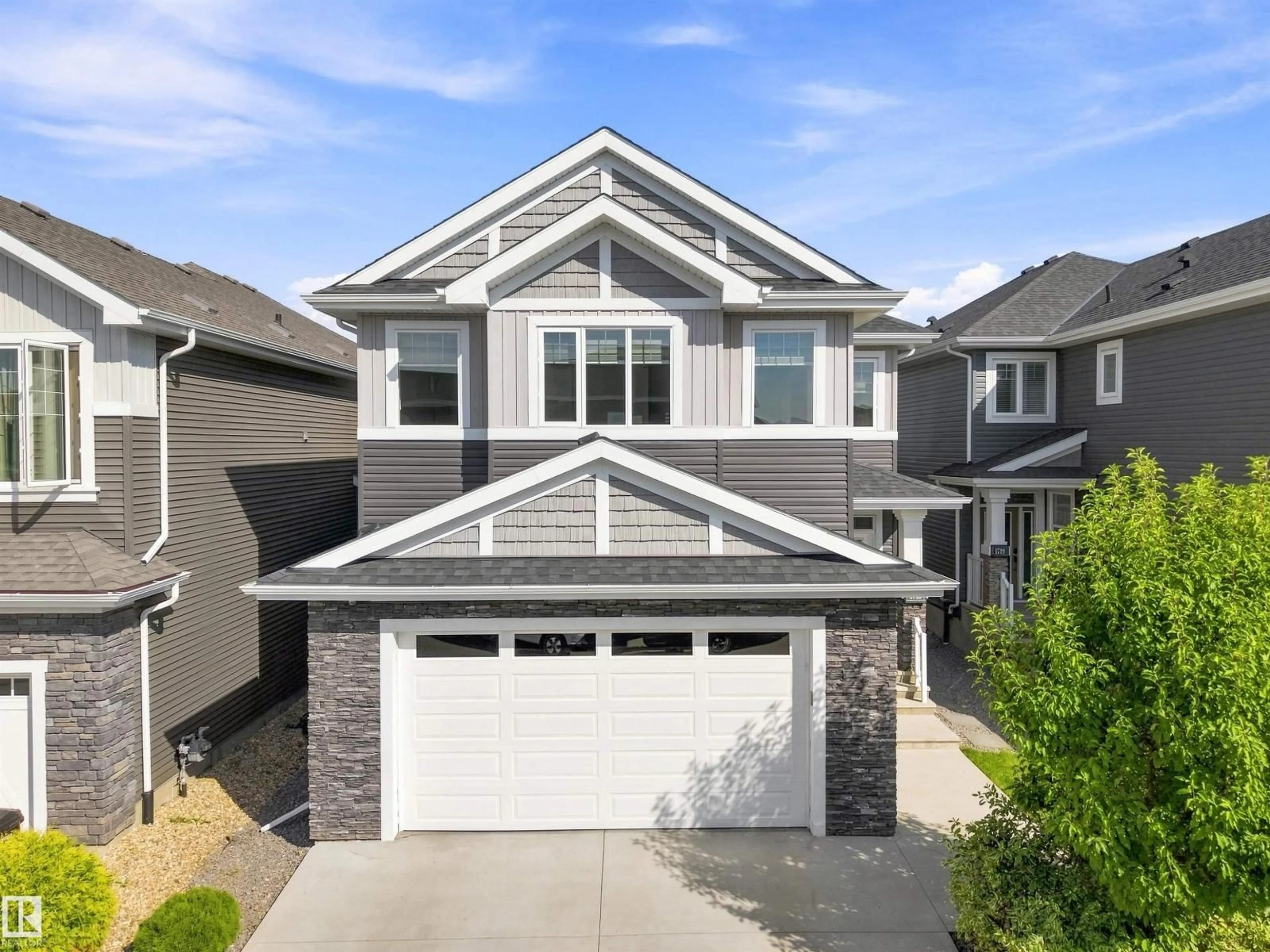 Home with vinyl exterior material, street for SW - 1715 163 ST, Edmonton Alberta T6W3P6