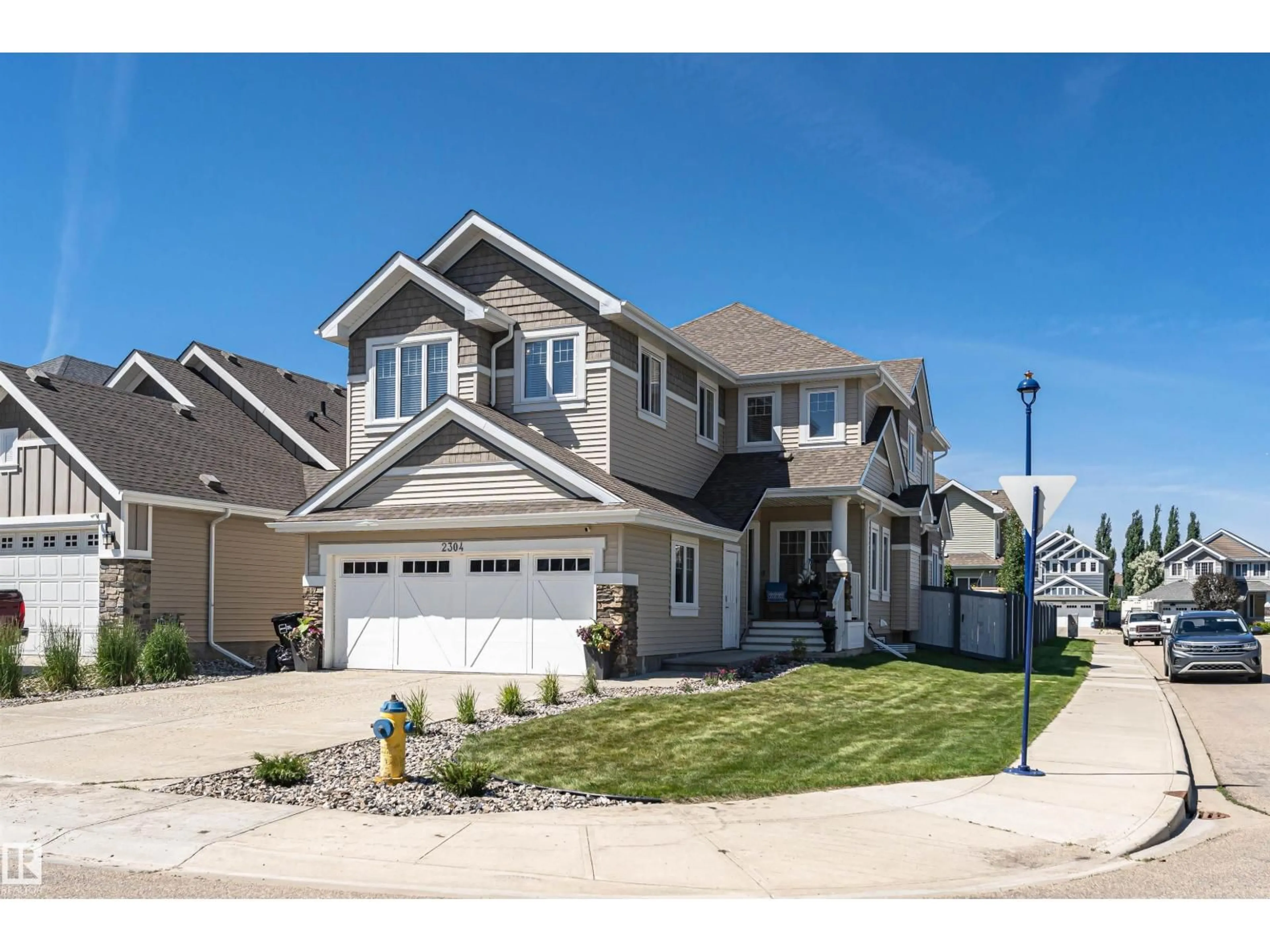 Home with vinyl exterior material, street for SW - 2304 89 ST, Edmonton Alberta T6X0R9