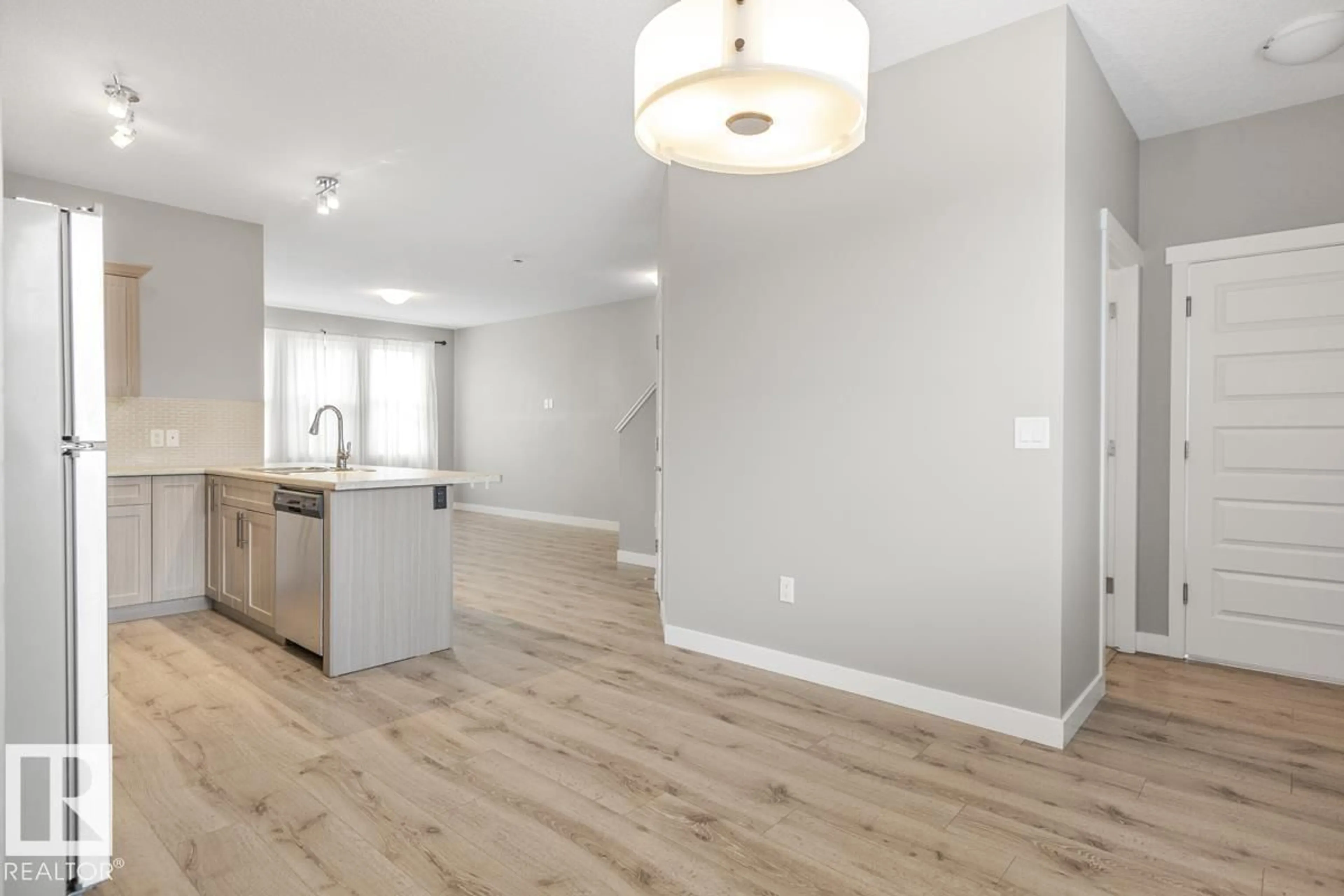 Open concept kitchen, wood/laminate floor for 22 HOPE CM, Spruce Grove Alberta T7X3T3