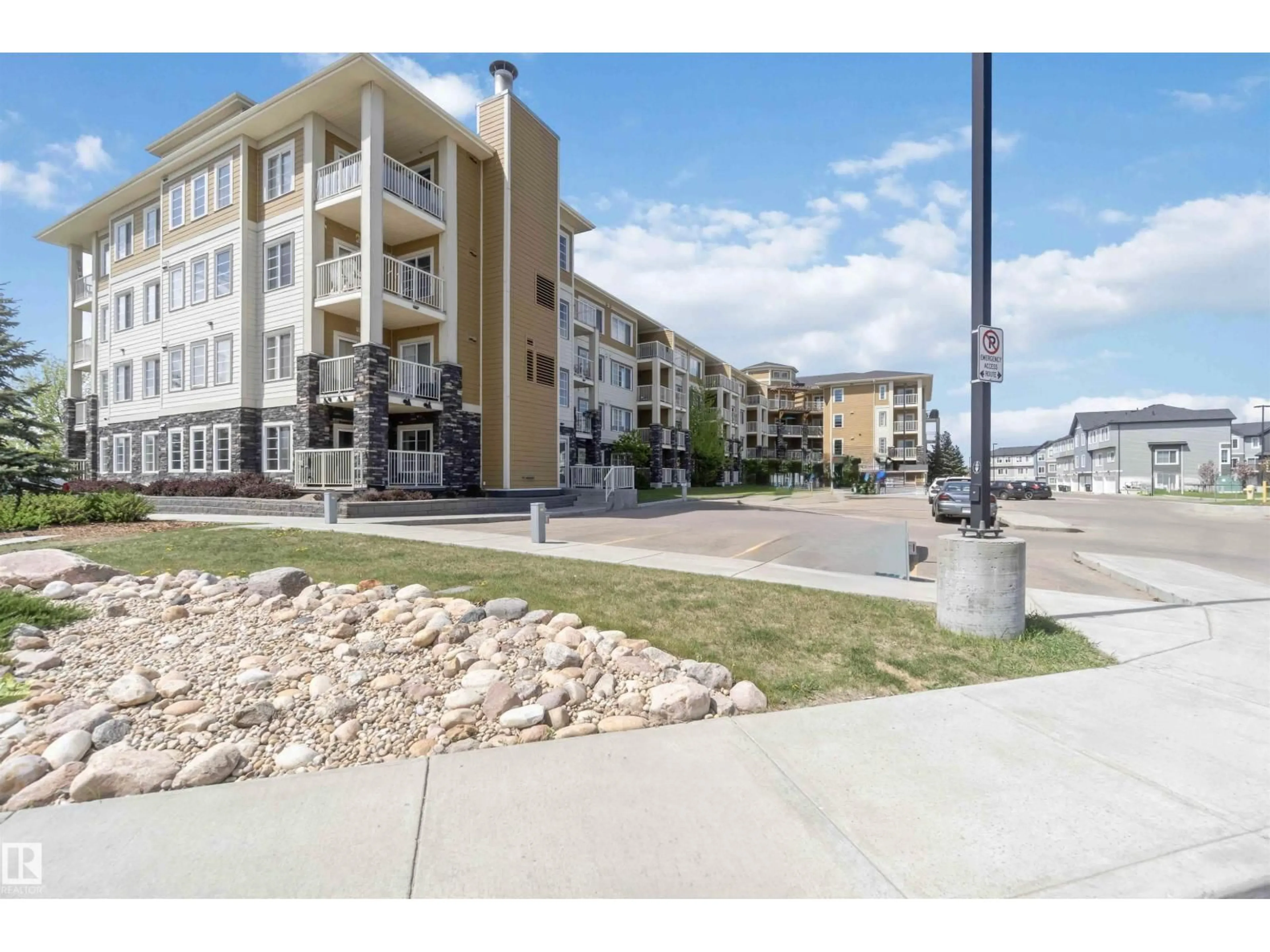 Patio, water/lake/river/ocean view for 411 - 3670 139 AV NW, Edmonton Alberta T5Y3N5