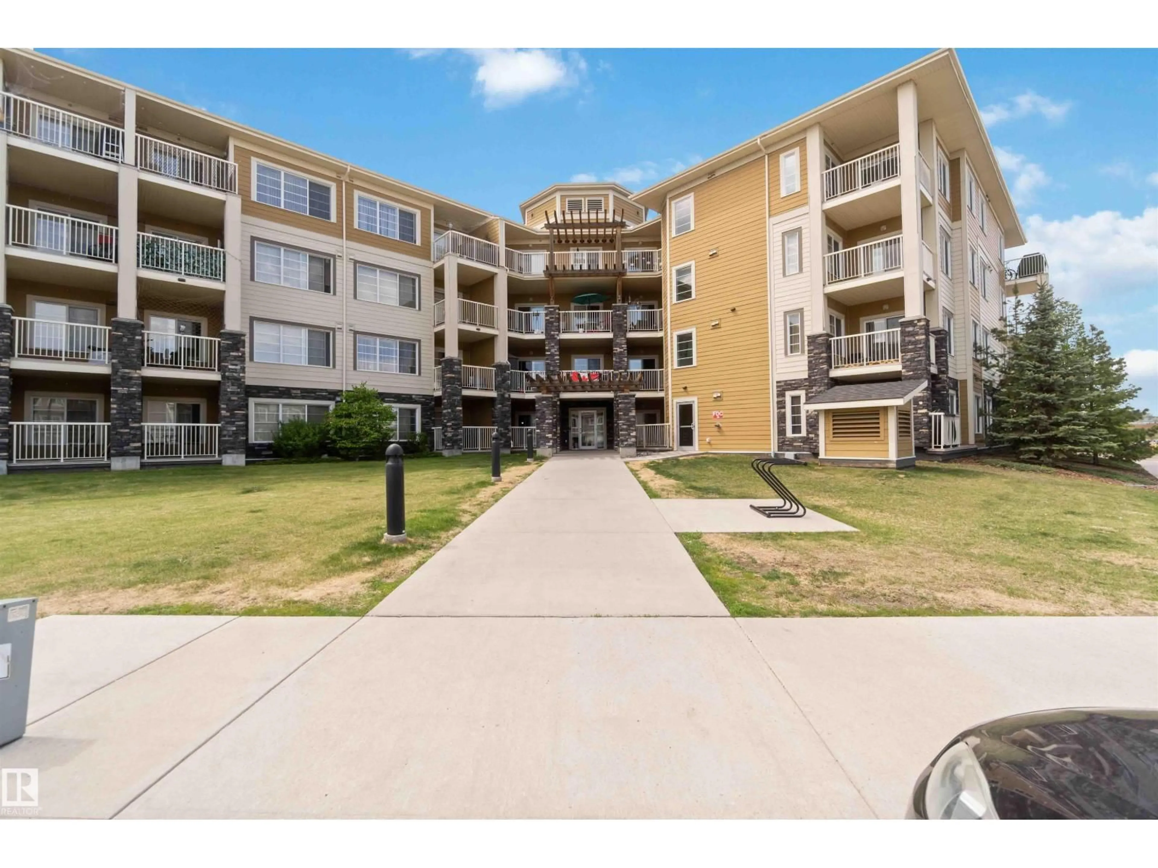 A pic from outside/outdoor area/front of a property/back of a property/a pic from drone, unknown for 411 - 3670 139 AV NW, Edmonton Alberta T5Y3N5