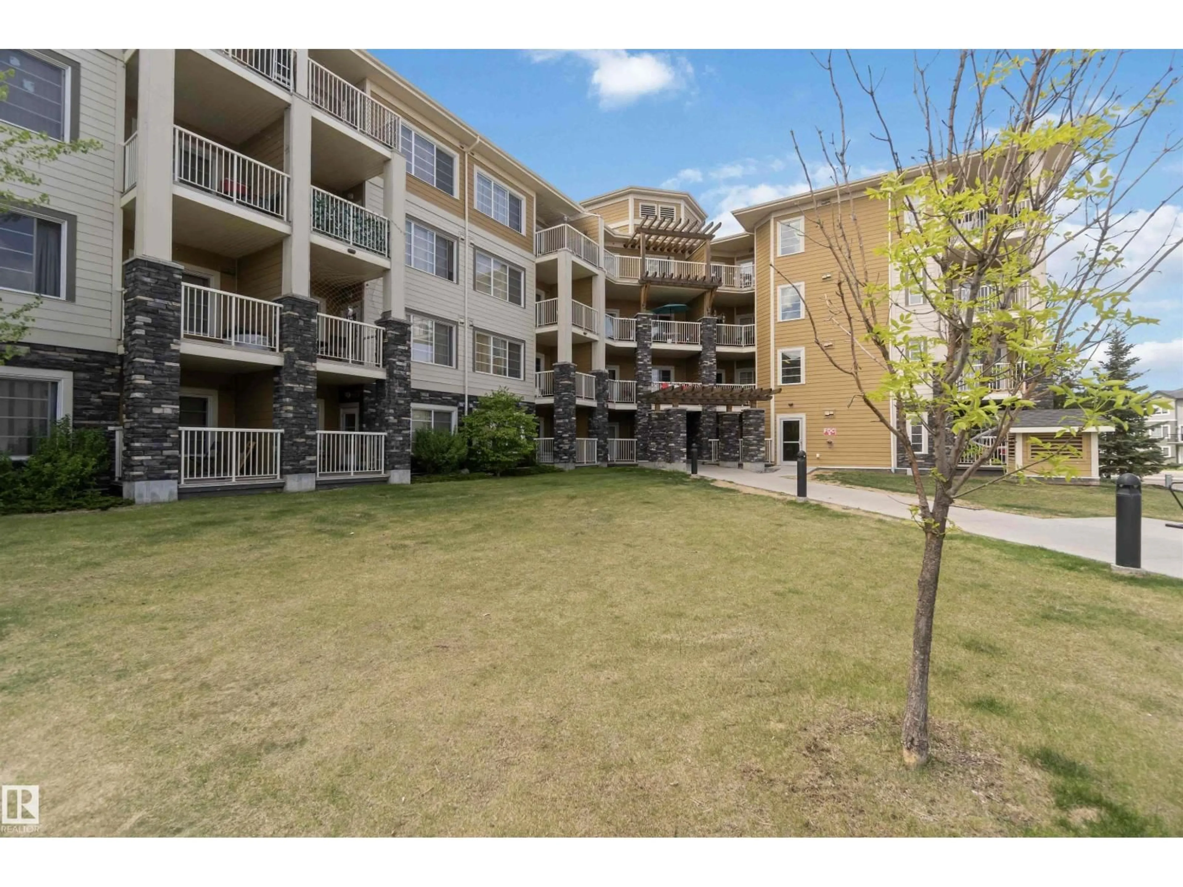 A pic from outside/outdoor area/front of a property/back of a property/a pic from drone, unknown for 411 - 3670 139 AV NW, Edmonton Alberta T5Y3N5