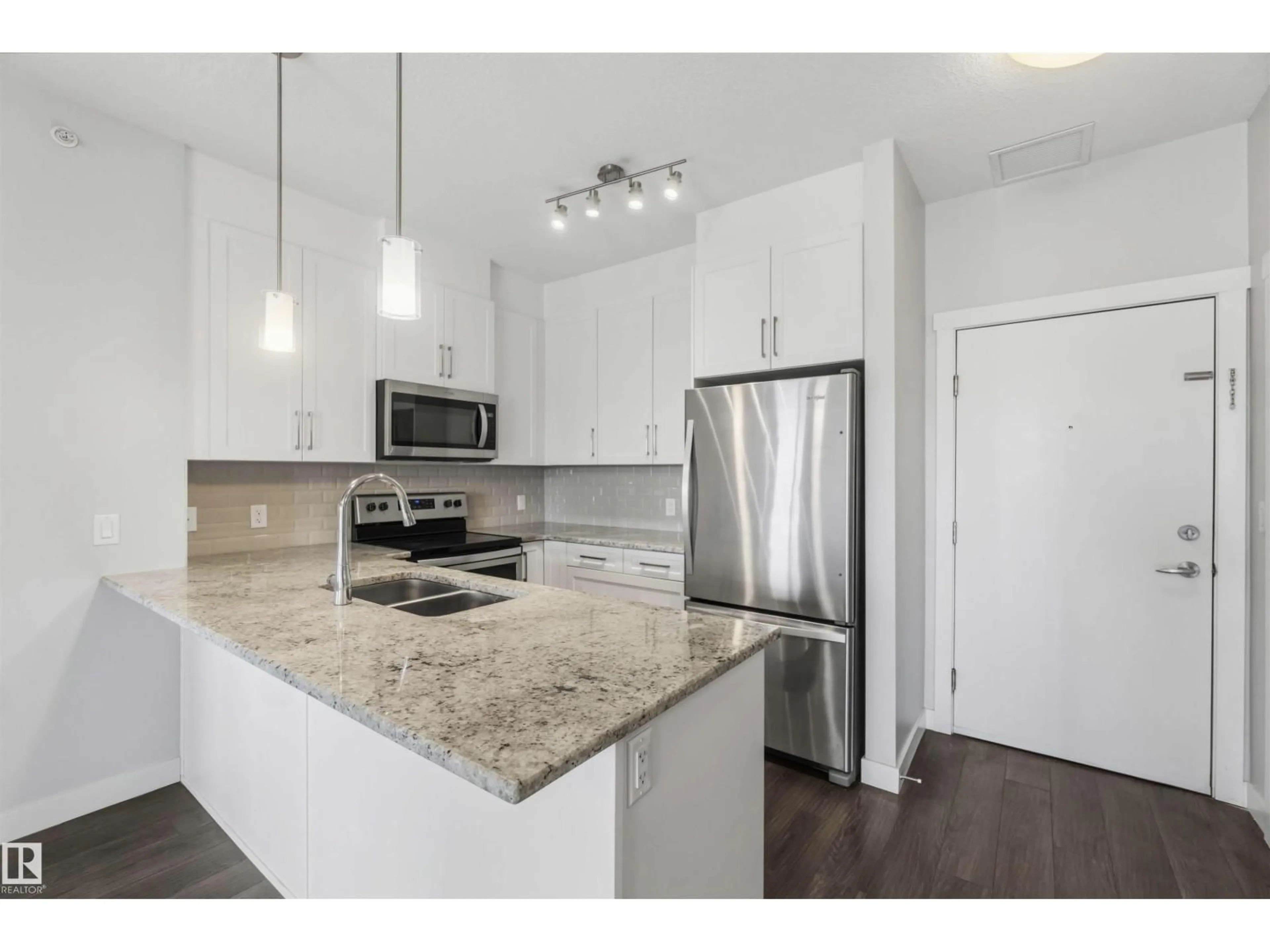 Open concept kitchen, unknown for 411 - 3670 139 AV NW, Edmonton Alberta T5Y3N5