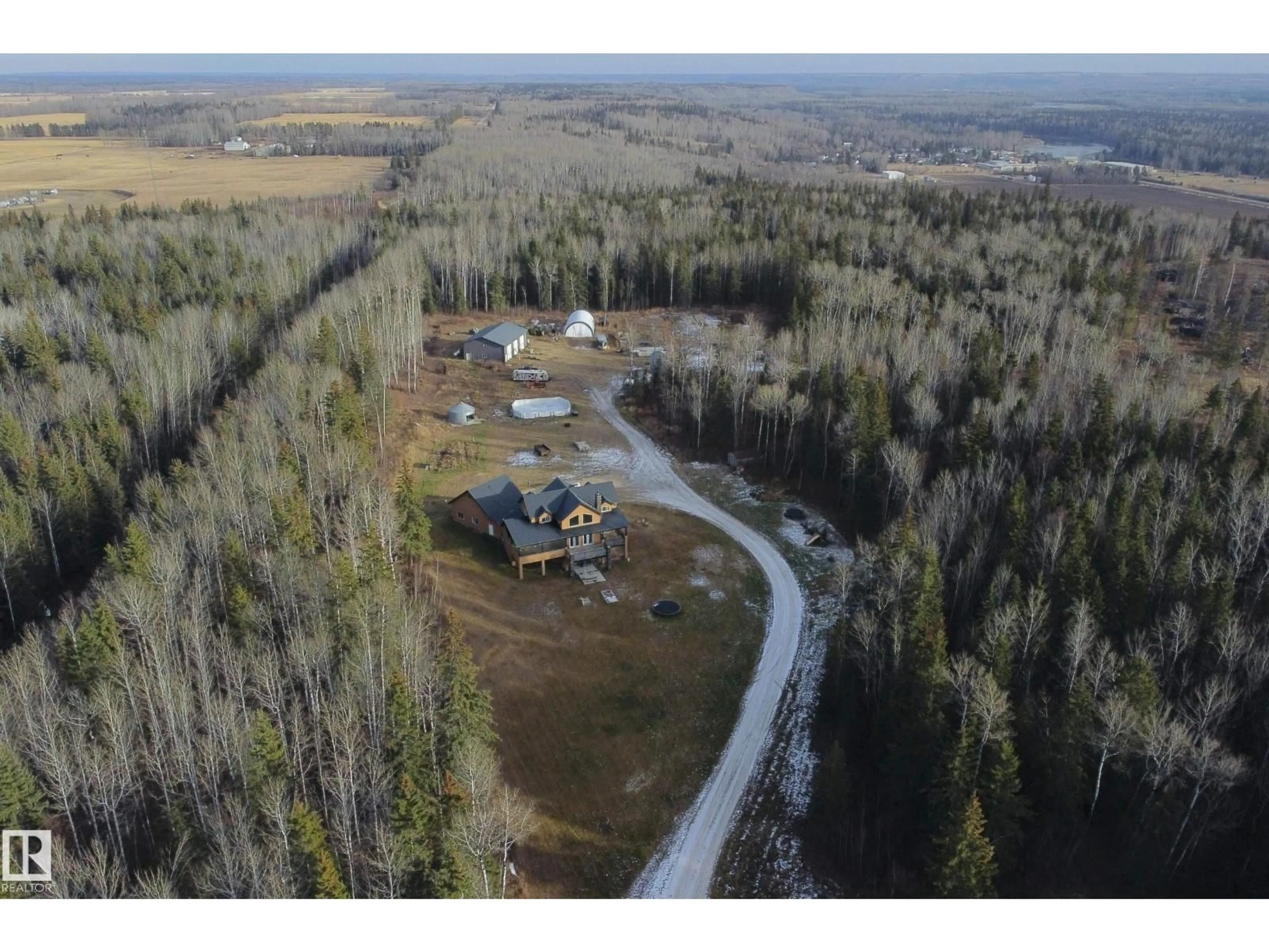 A pic from outside/outdoor area/front of a property/back of a property/a pic from drone, forest/trees view for 33 - 62 RNG RD HWY, Rural Woodlands County Alberta T0G1A0