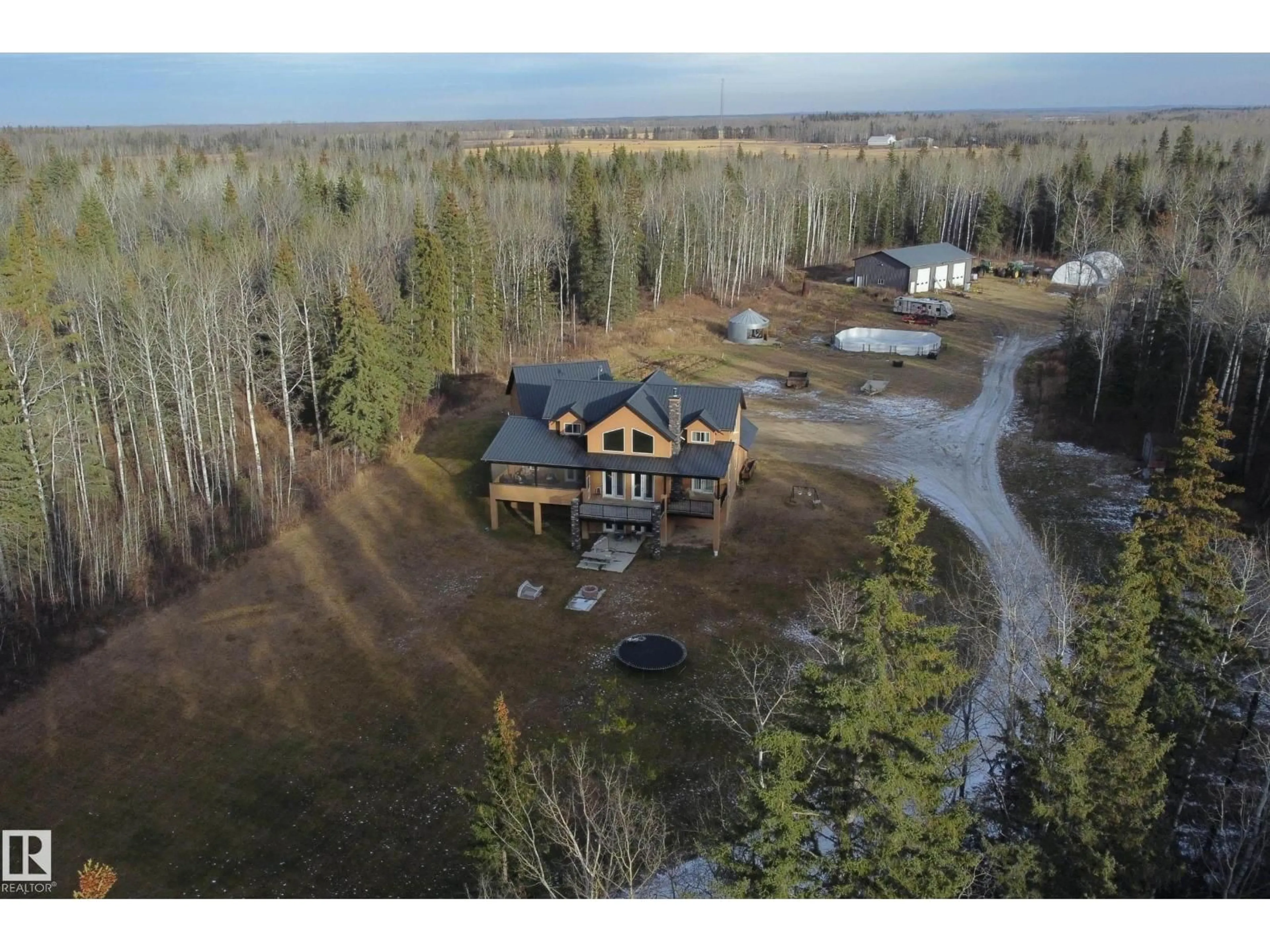 A pic from outside/outdoor area/front of a property/back of a property/a pic from drone, unknown for 33 - 62 RNG RD HWY, Rural Woodlands County Alberta T0G1A0