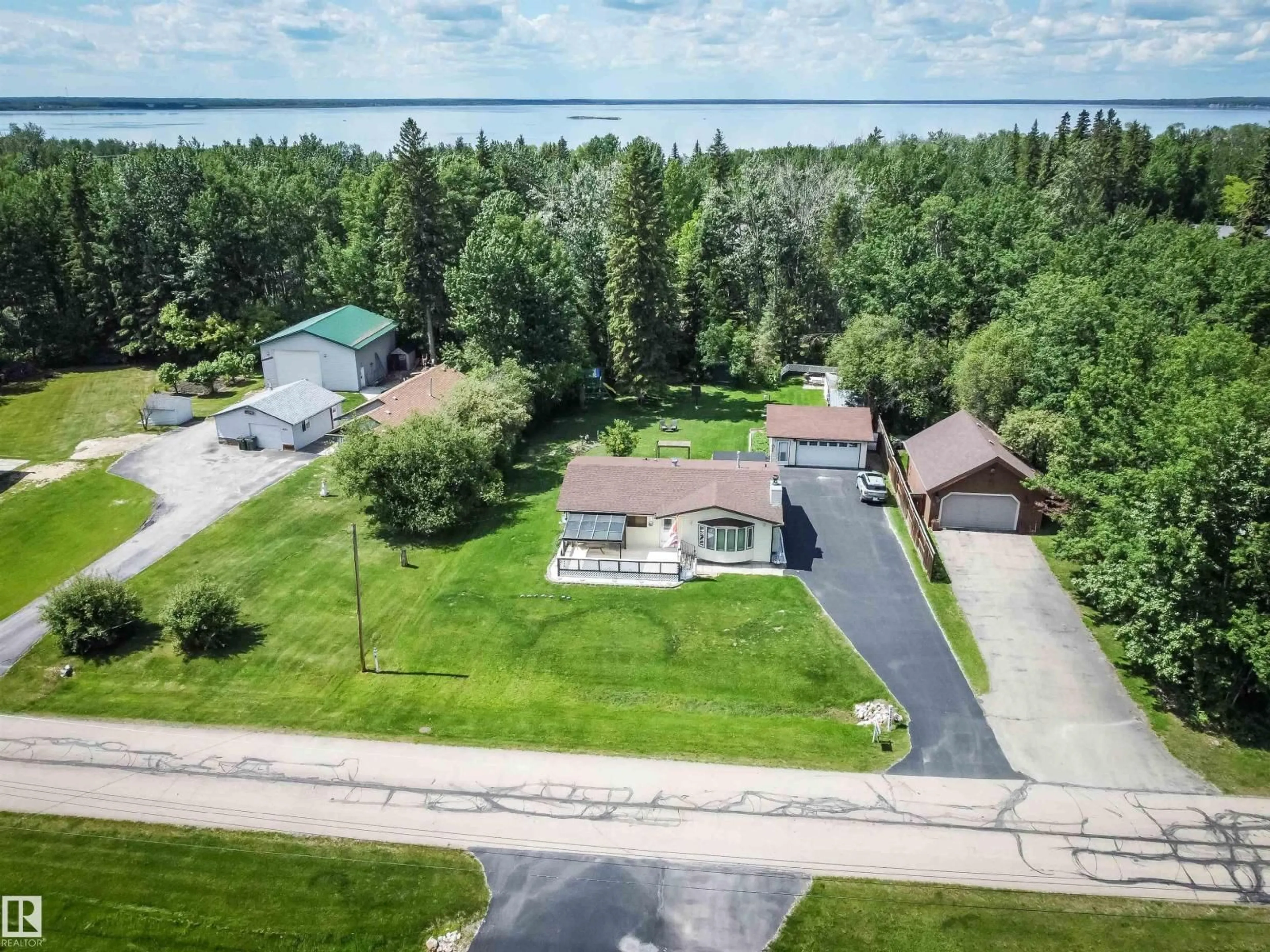 A pic from outside/outdoor area/front of a property/back of a property/a pic from drone, water/lake/river/ocean view for 4828 48 ST, Rural Lac Ste. Anne County Alberta T0E0A0