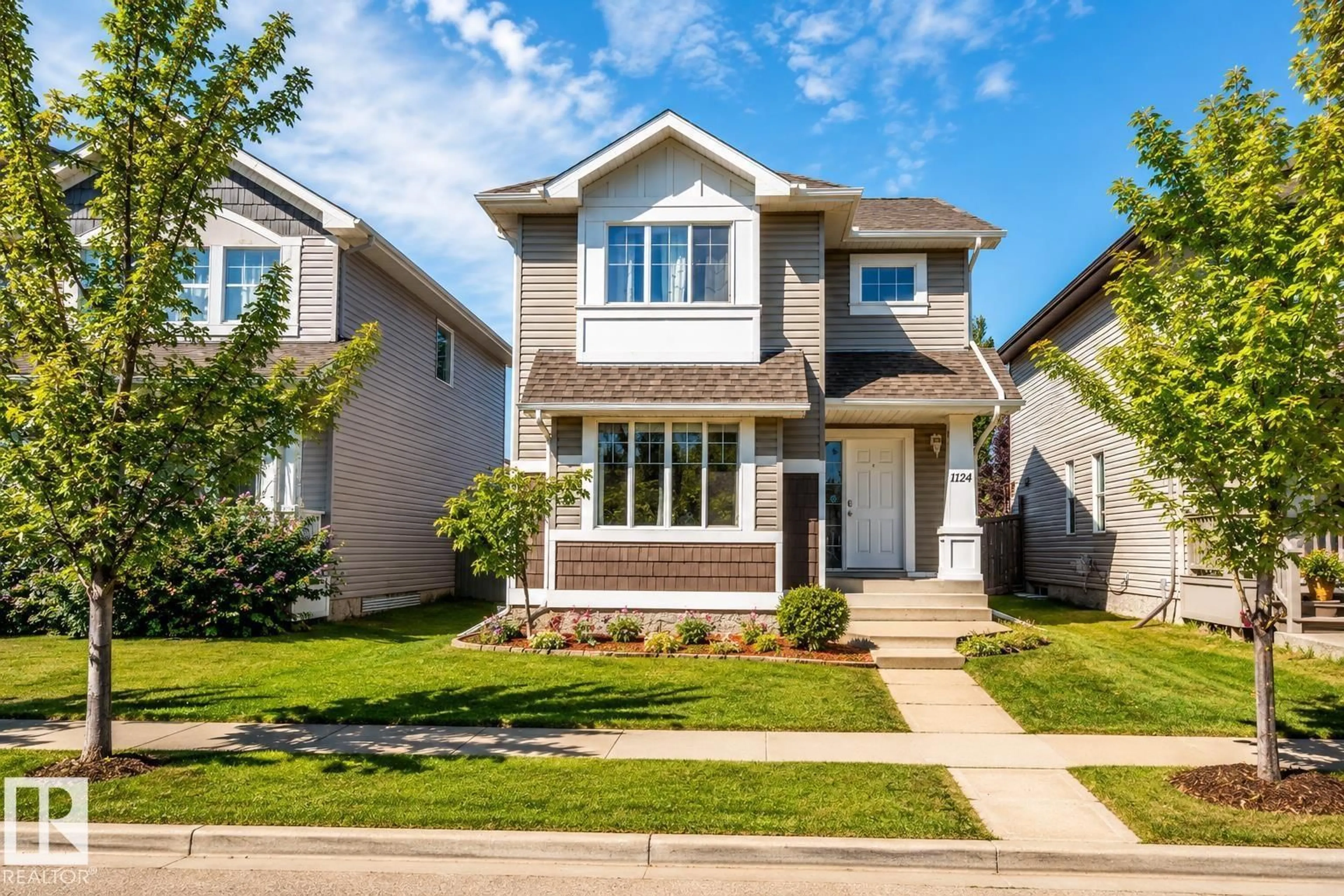 Home with vinyl exterior material, street for 1124 37A AV, Edmonton Alberta T6T0E7