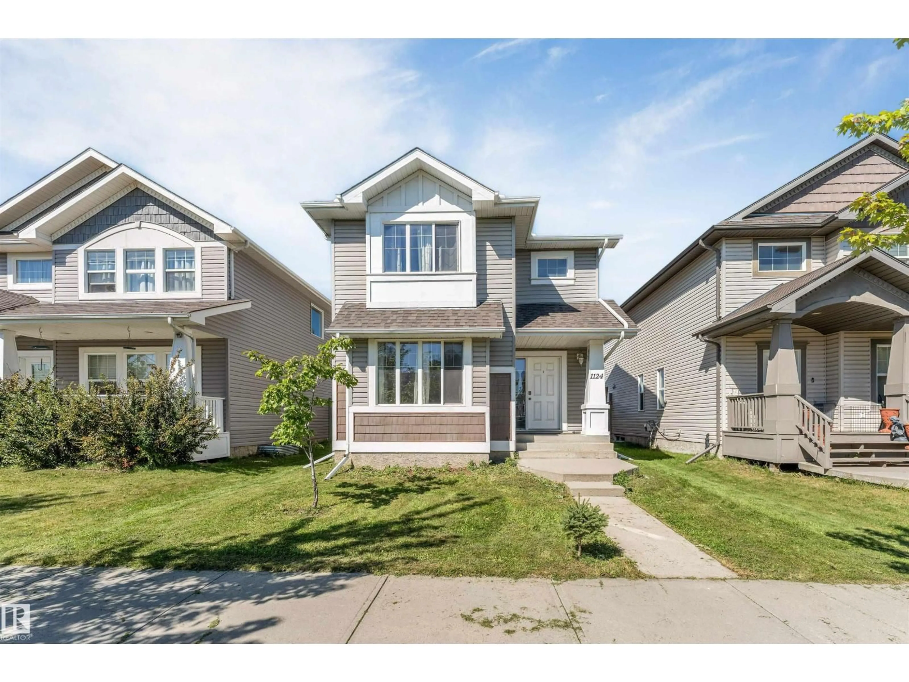 Home with vinyl exterior material, street for 1124 37A AV, Edmonton Alberta T6T0E7