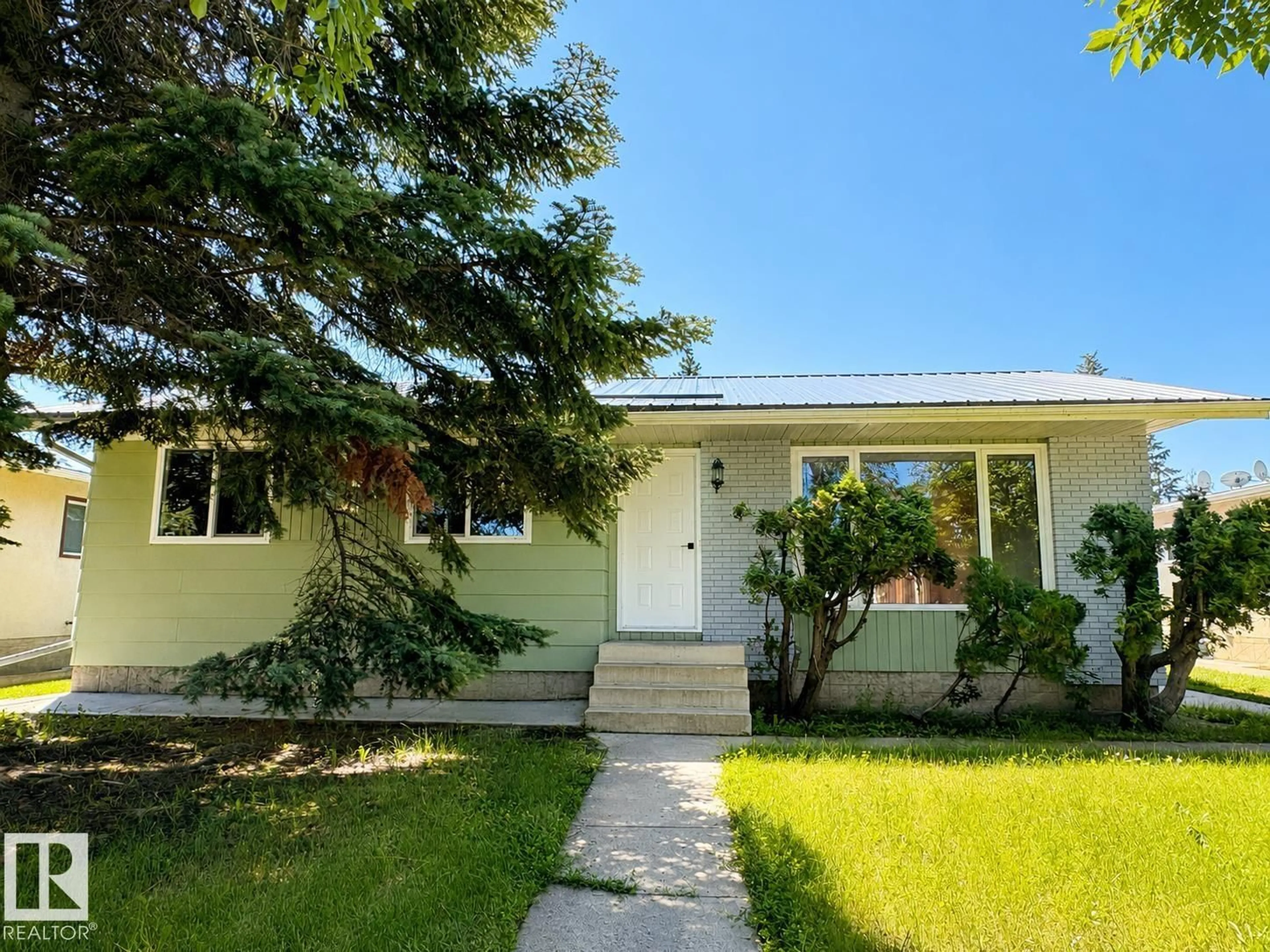 Home with vinyl exterior material, street for 4418 45 AV, Bonnyville Town Alberta T9N1X5