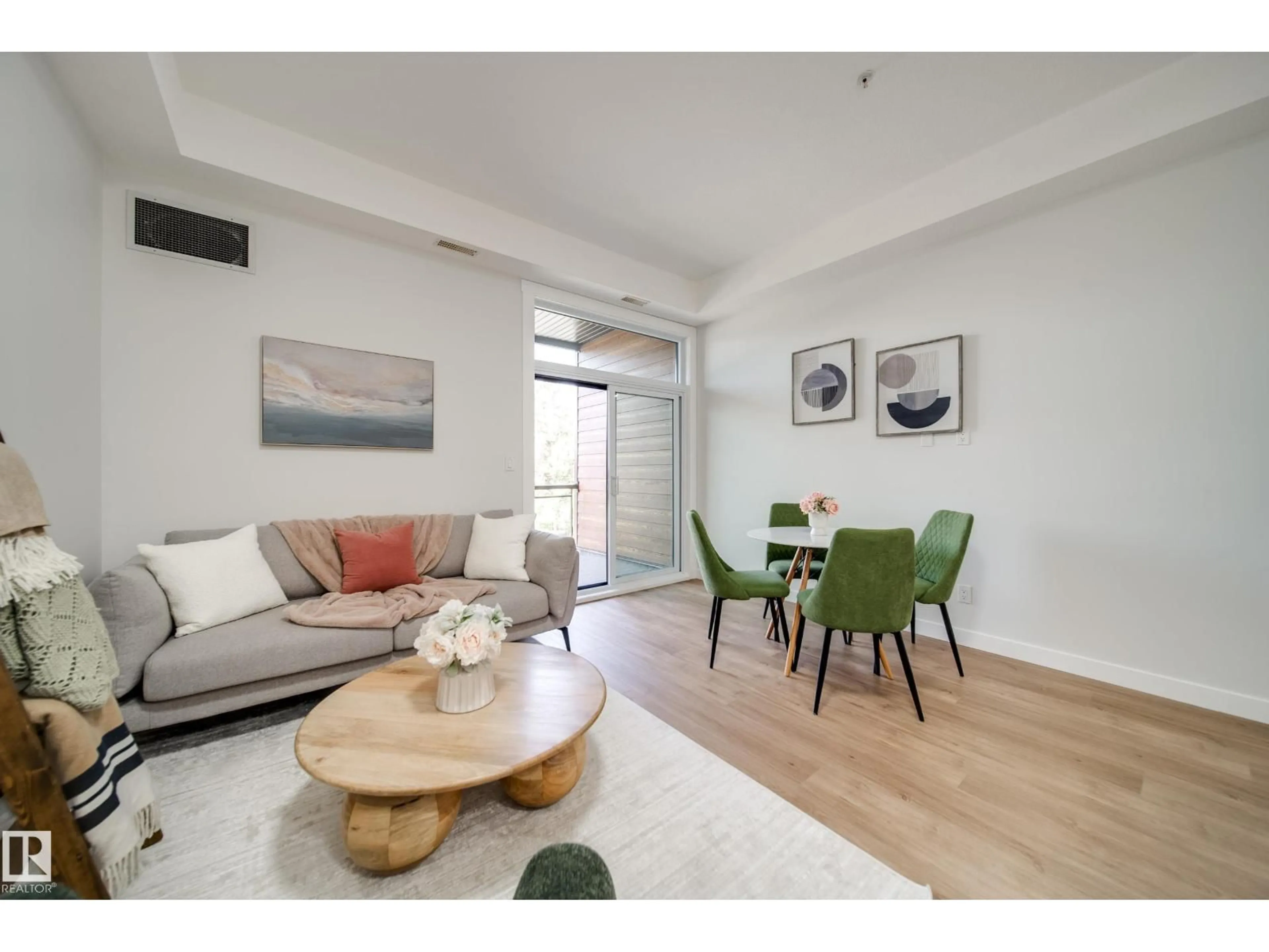 Living room with furniture, wood/laminate floor for #228 - 10531 117 ST, Edmonton Alberta T5H0A8
