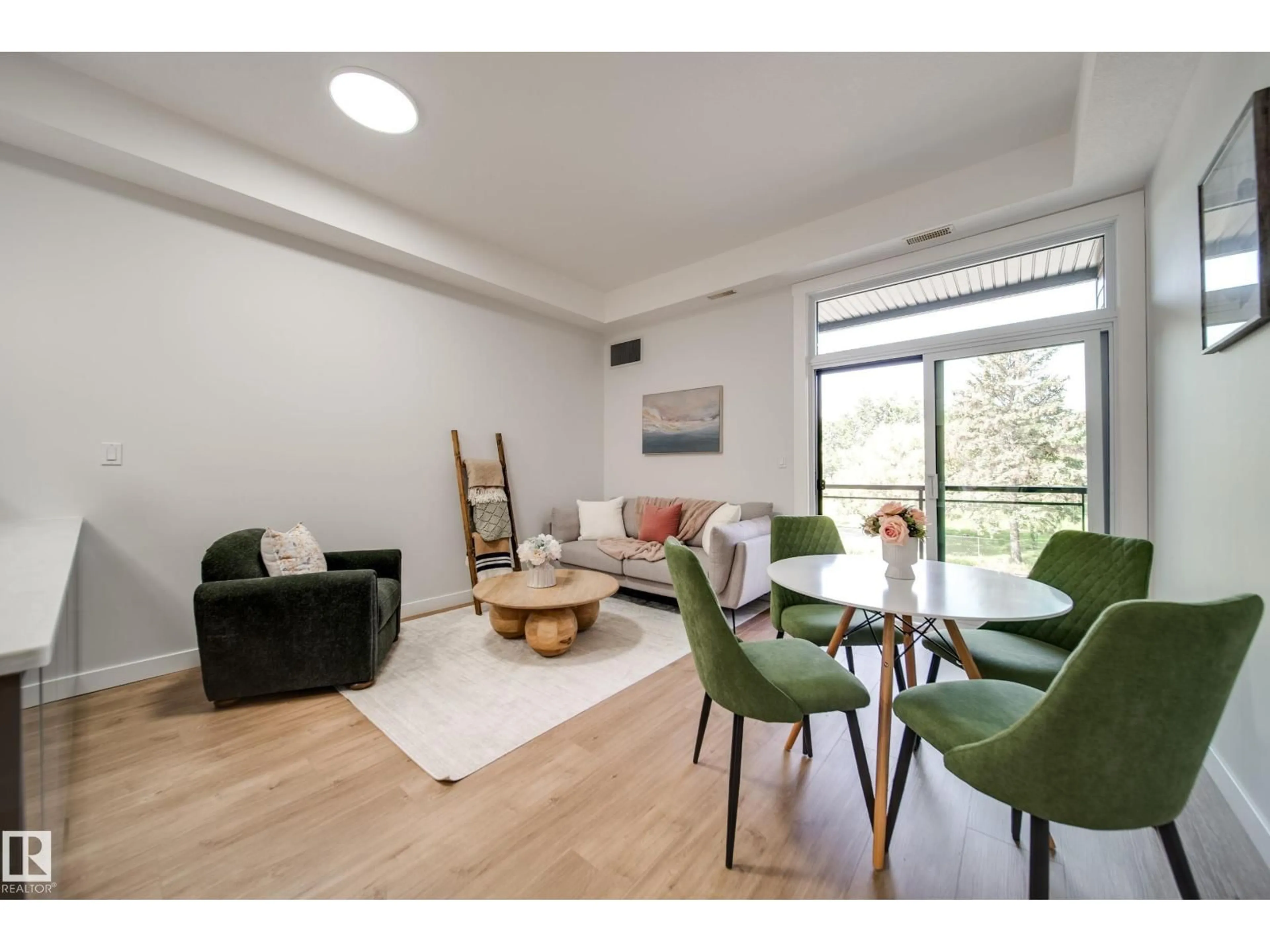 Living room with furniture, wood/laminate floor for #228 - 10531 117 ST, Edmonton Alberta T5H0A8
