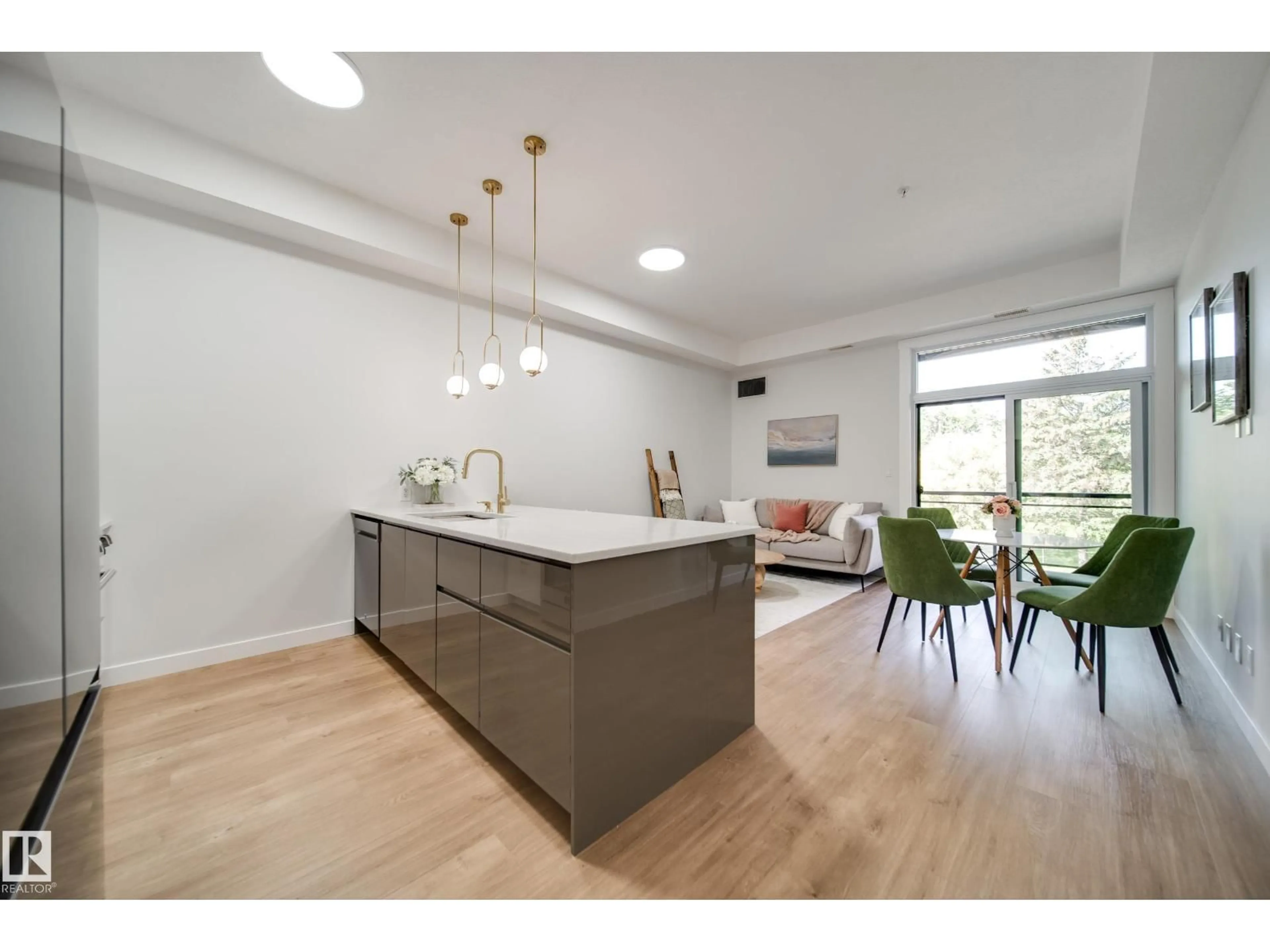 Open concept kitchen, wood/laminate floor for #228 - 10531 117 ST, Edmonton Alberta T5H0A8