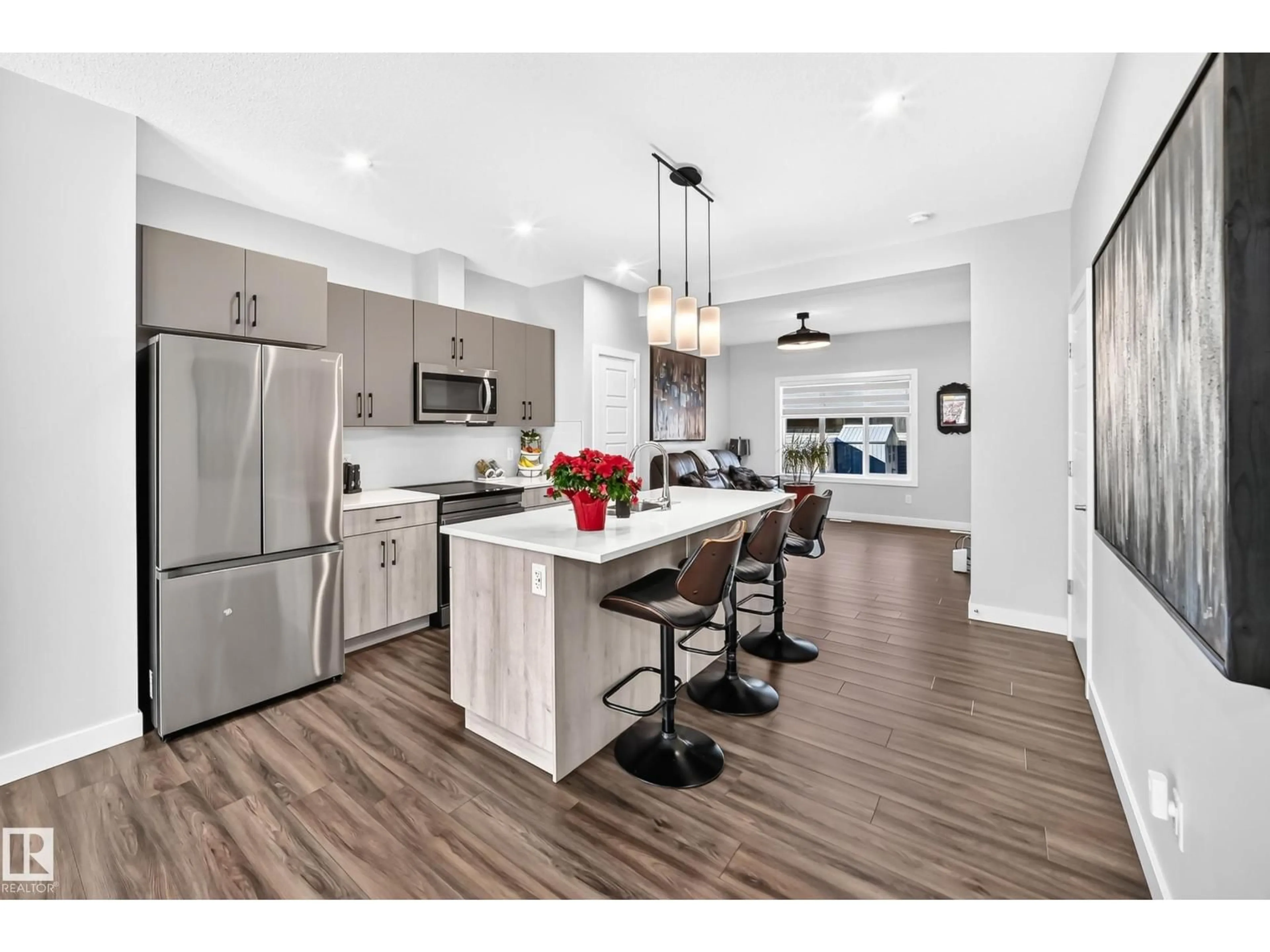 Open concept kitchen, wood/laminate floor for 139 CASTILIAN BV, Sherwood Park Alberta T8H2Z9