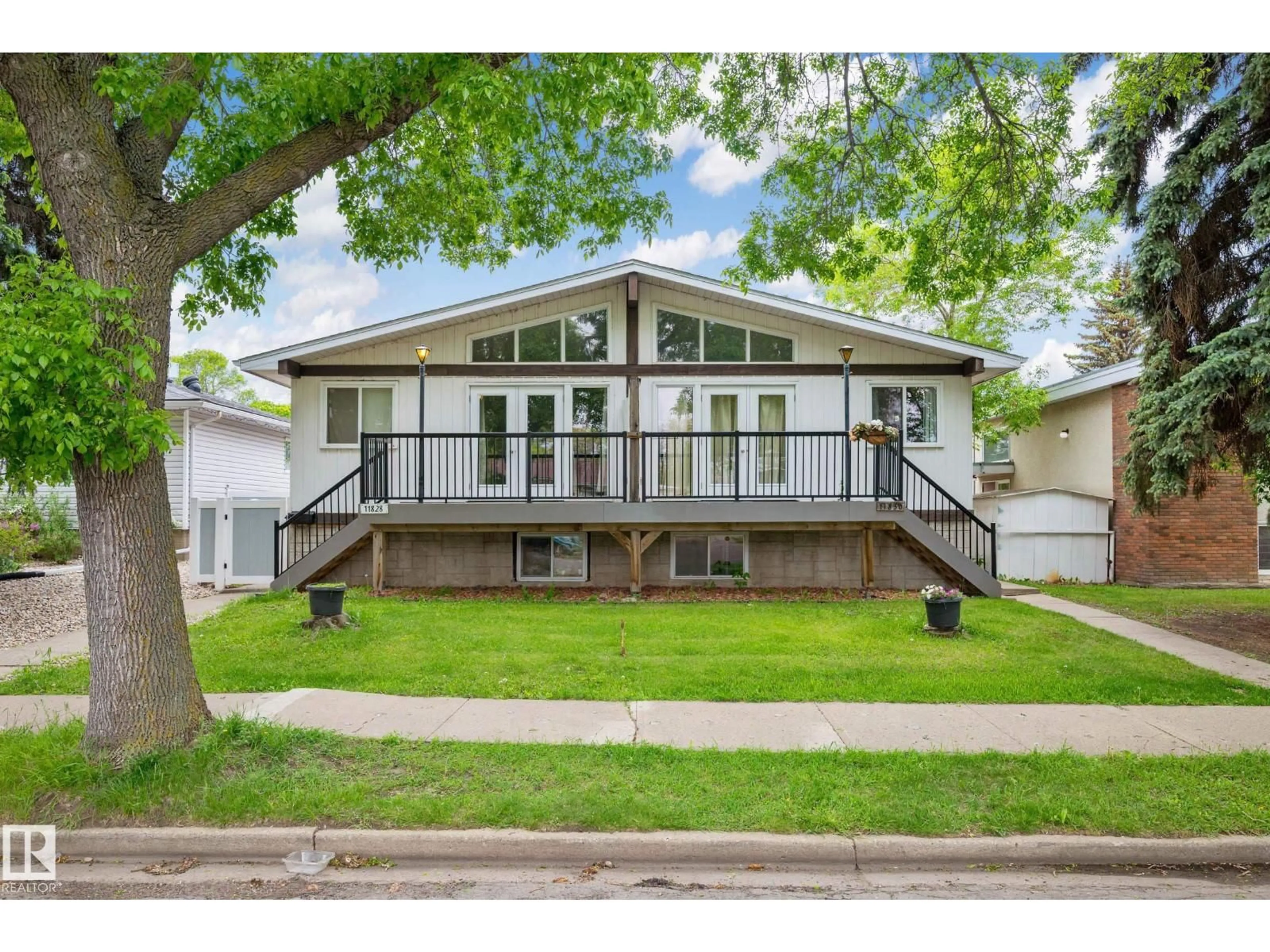 Home with vinyl exterior material, street for NW - 11828 & 11830 45 ST, Edmonton Alberta T5W2T4