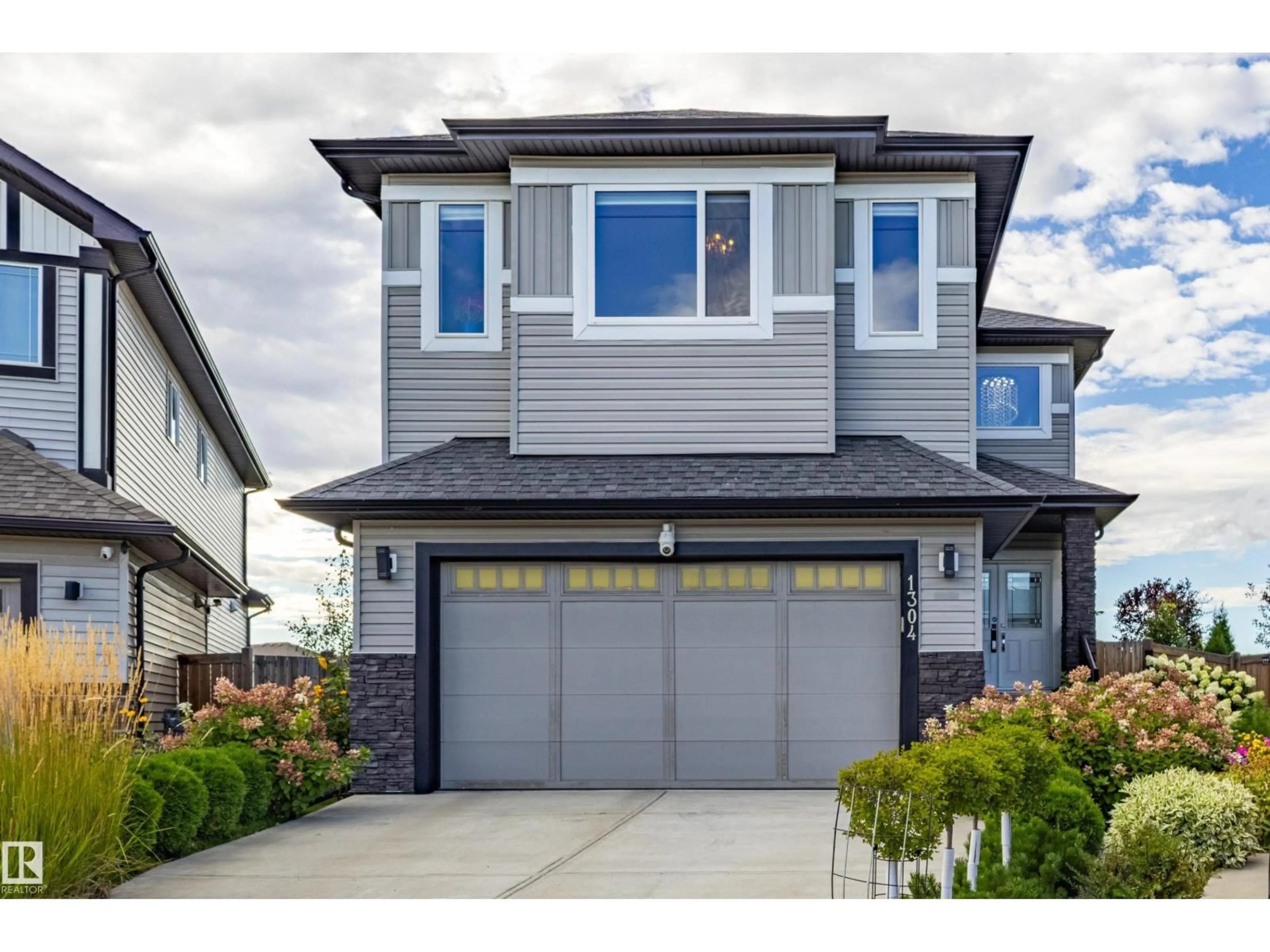 Home with vinyl exterior material, street for SW - 1304 165 ST, Edmonton Alberta T6W3S6