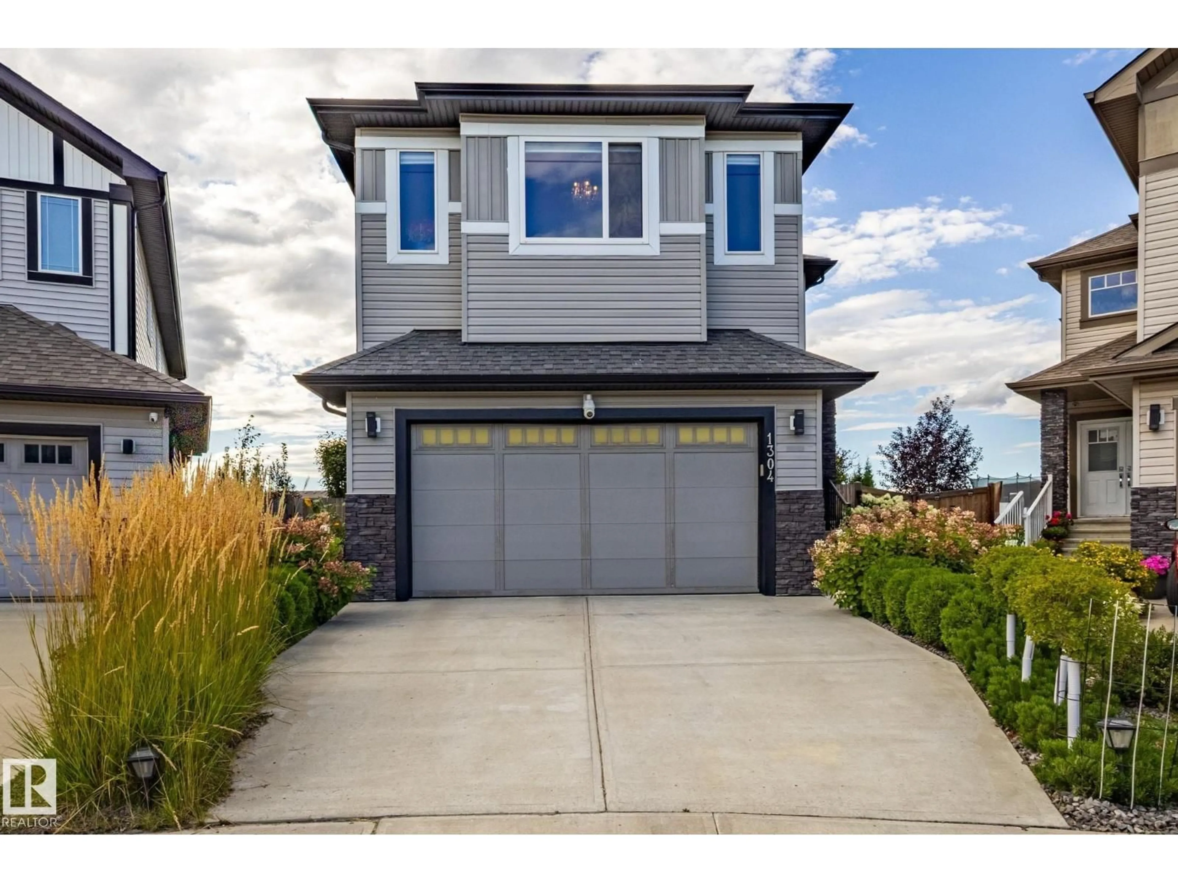 Home with vinyl exterior material, street for SW - 1304 165 ST, Edmonton Alberta T6W3S6