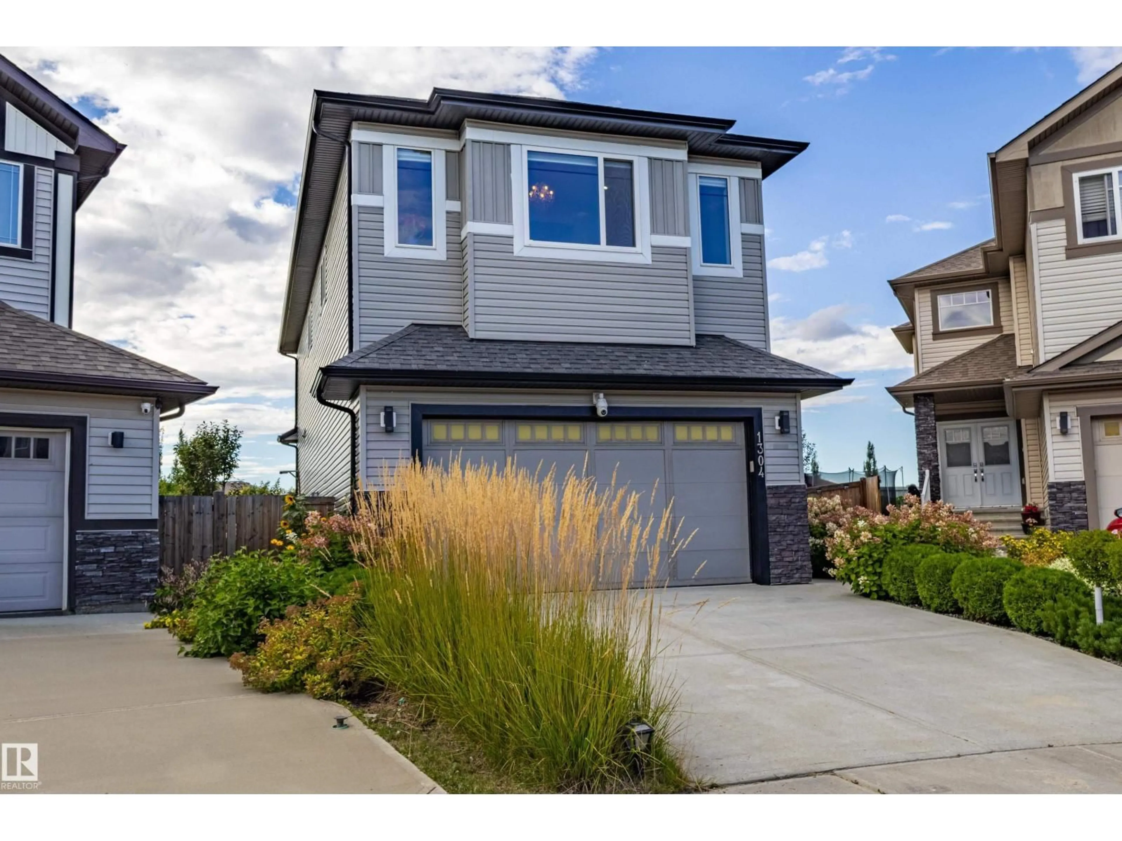 Home with vinyl exterior material, street for SW - 1304 165 ST, Edmonton Alberta T6W3S6
