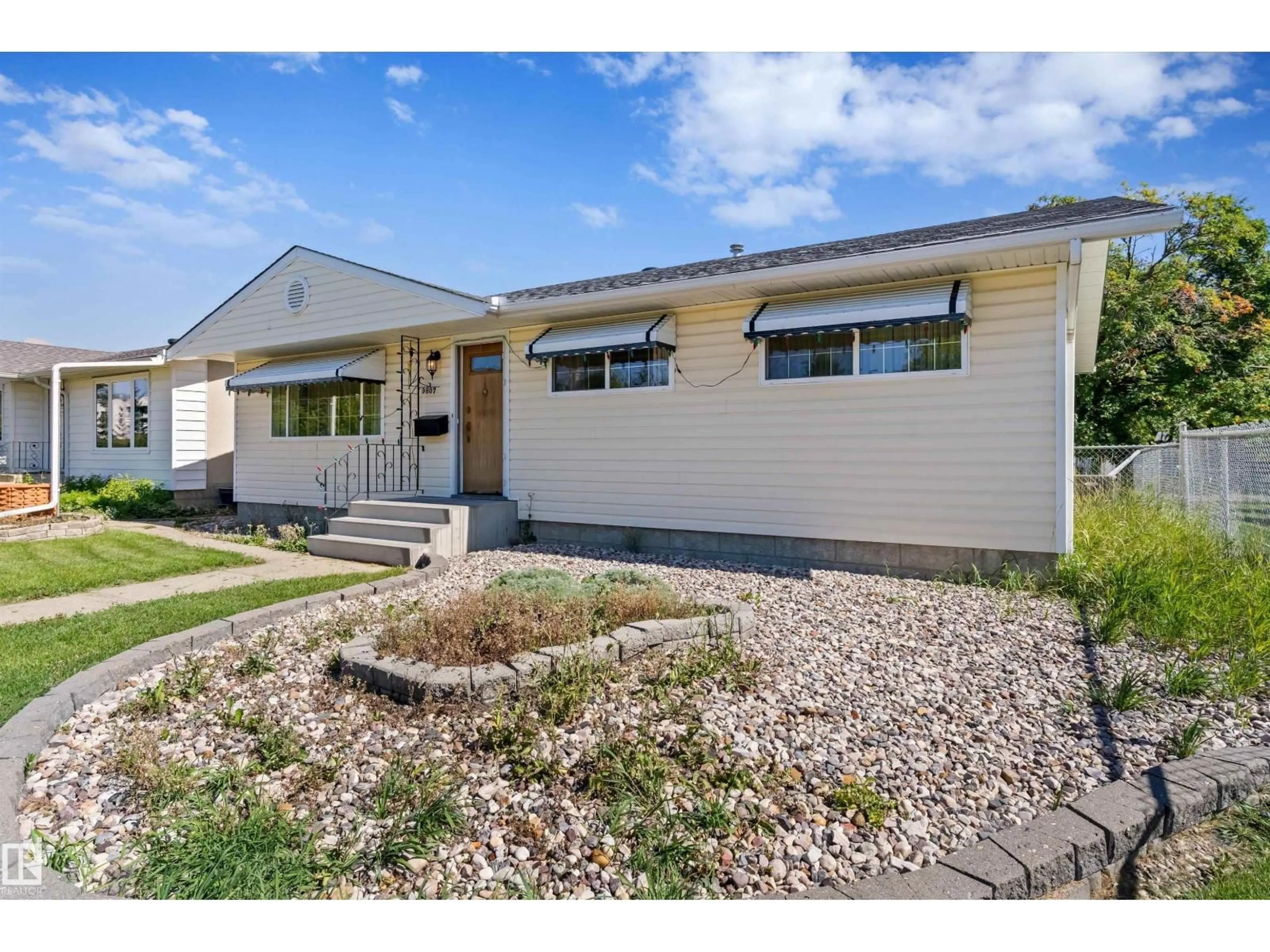 Home with vinyl exterior material, street for NW - 9807 165 ST, Edmonton Alberta T5P3S9