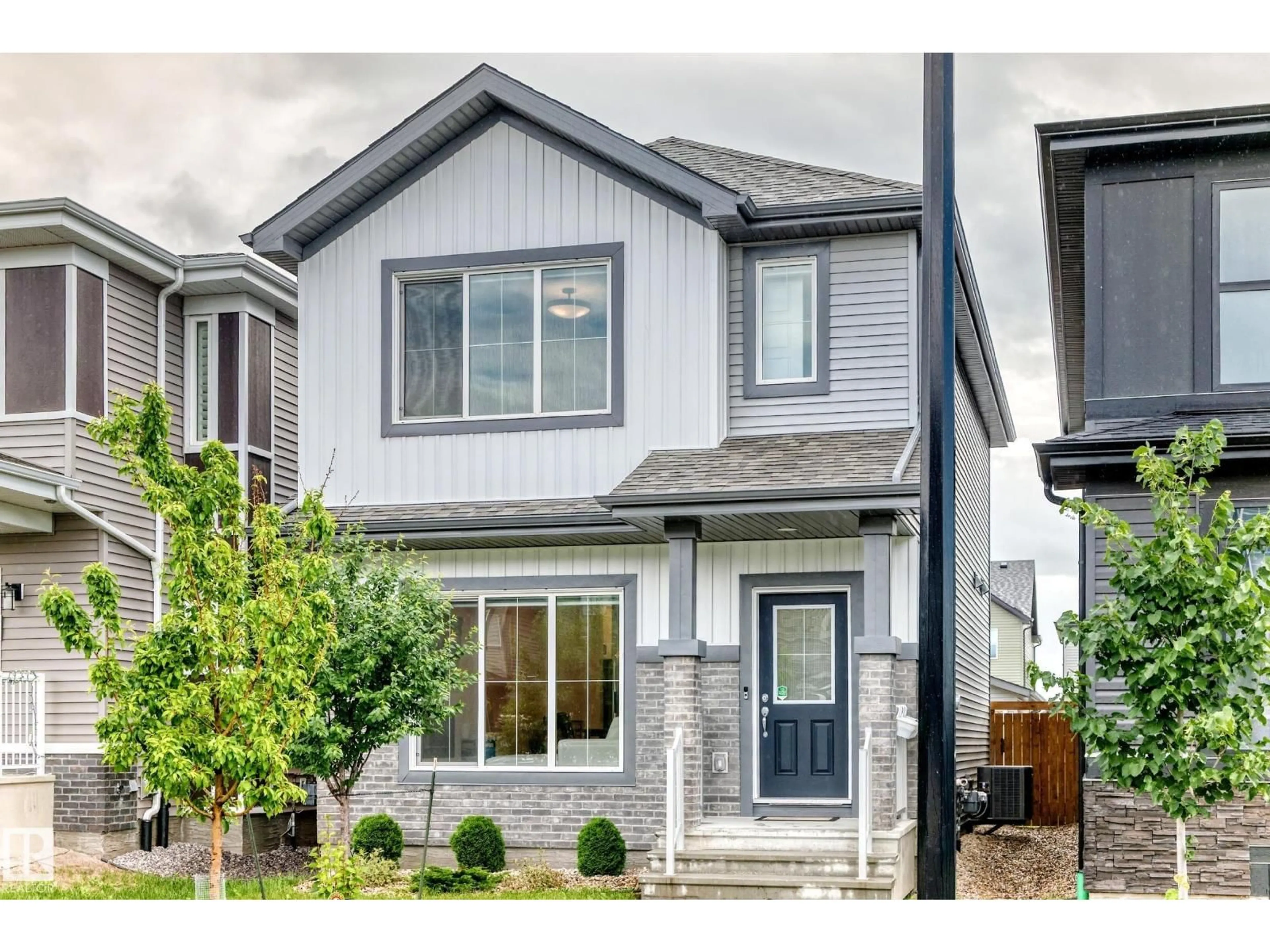 Home with vinyl exterior material, street for SW - 1975 160 ST, Edmonton Alberta T6W4X6