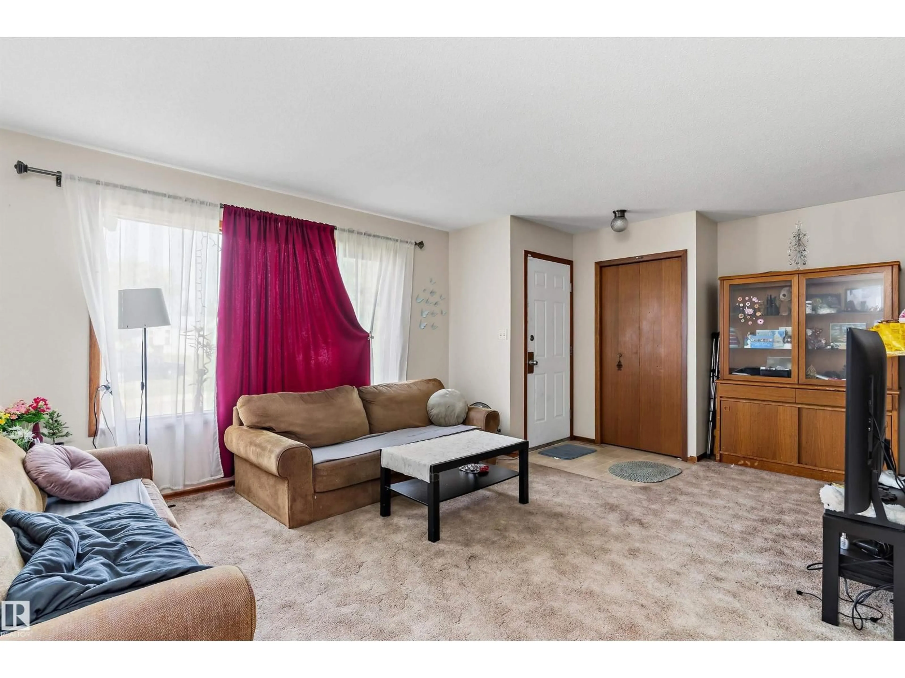 Living room with furniture, unknown for 3825/27 53A ST, Wetaskiwin Alberta T9A2P5